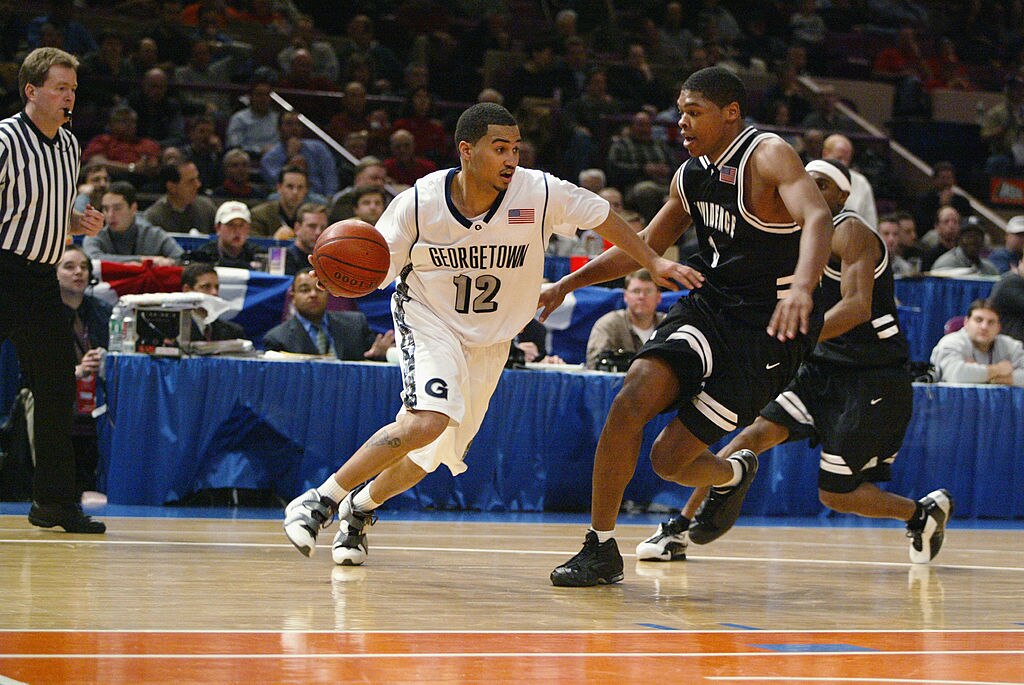 NEW YORK - MARCH 6:  Kevin Braswell #12 of the Georgetown Hoyas drives around Ryan Gomes #3 of the Providence Friars during the first round of the Big East Tournament at Madison Square Garden in New York, New York on March 6, 2002.  The Hoyas won 68-67.