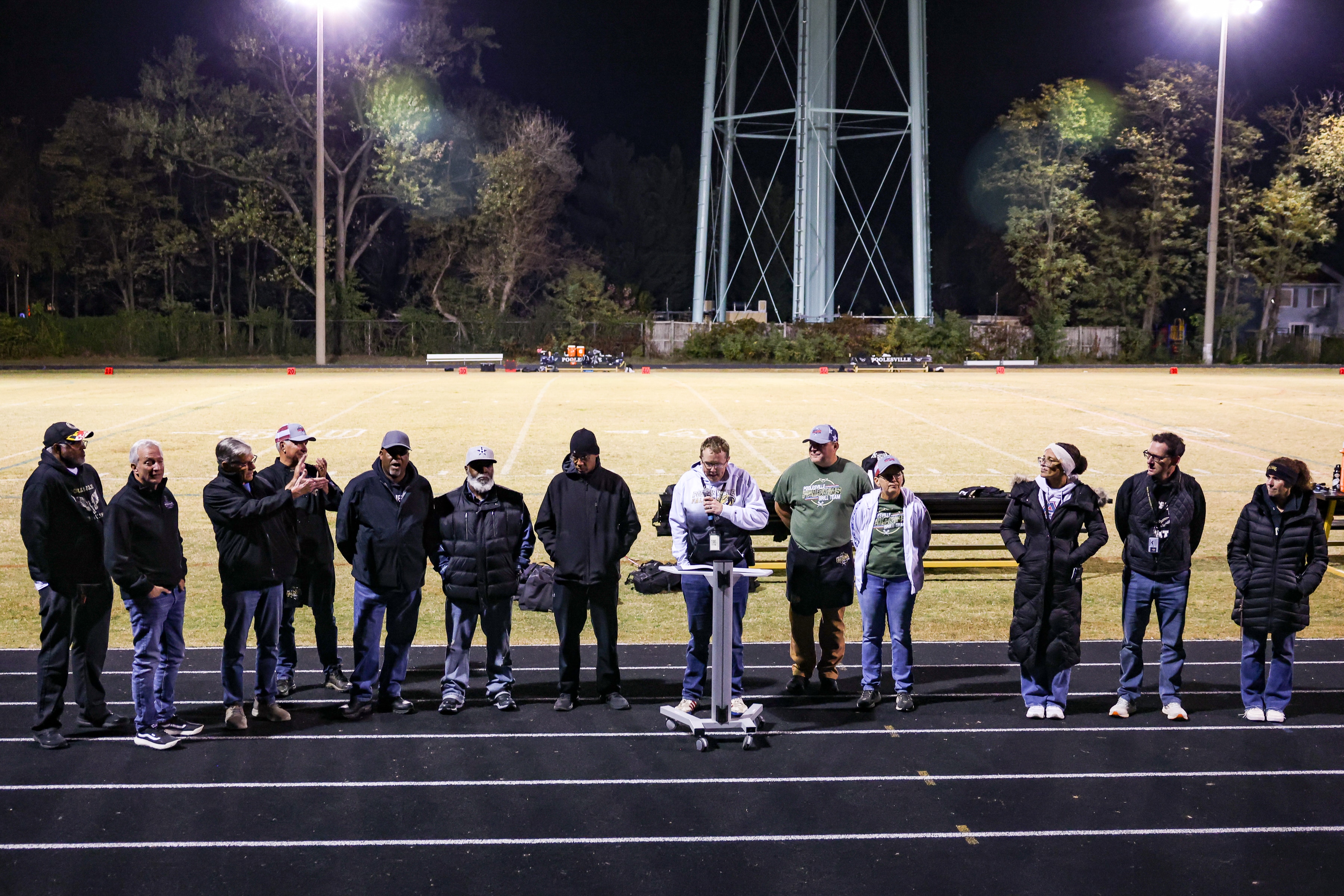 A ceremony marking the renaming of the football stadium after Howard Lyles takes place during halftime of a football game at Poolesville High School on Friday, October 24, 2025 in Poolesville, MD.