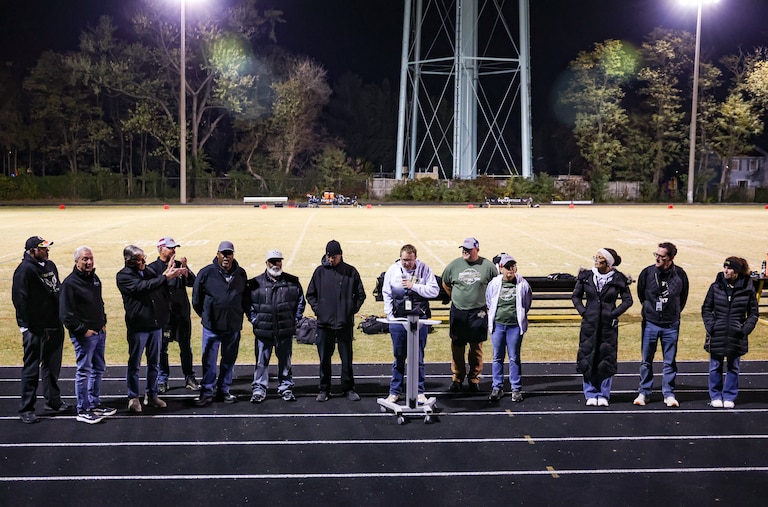 A ceremony marking the renaming of the football stadium after Howard Lyles takes place during halftime of a football game at Poolesville High School on Friday, October 24, 2025 in Poolesville, MD.