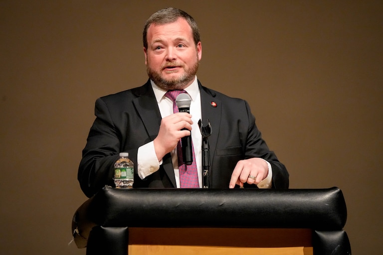 Baltimore County councilman Pat Young moderates a congressional town hall meeting at Woodlawn High School in Woodlawn, Md. on Thursday, March 20, 2025.