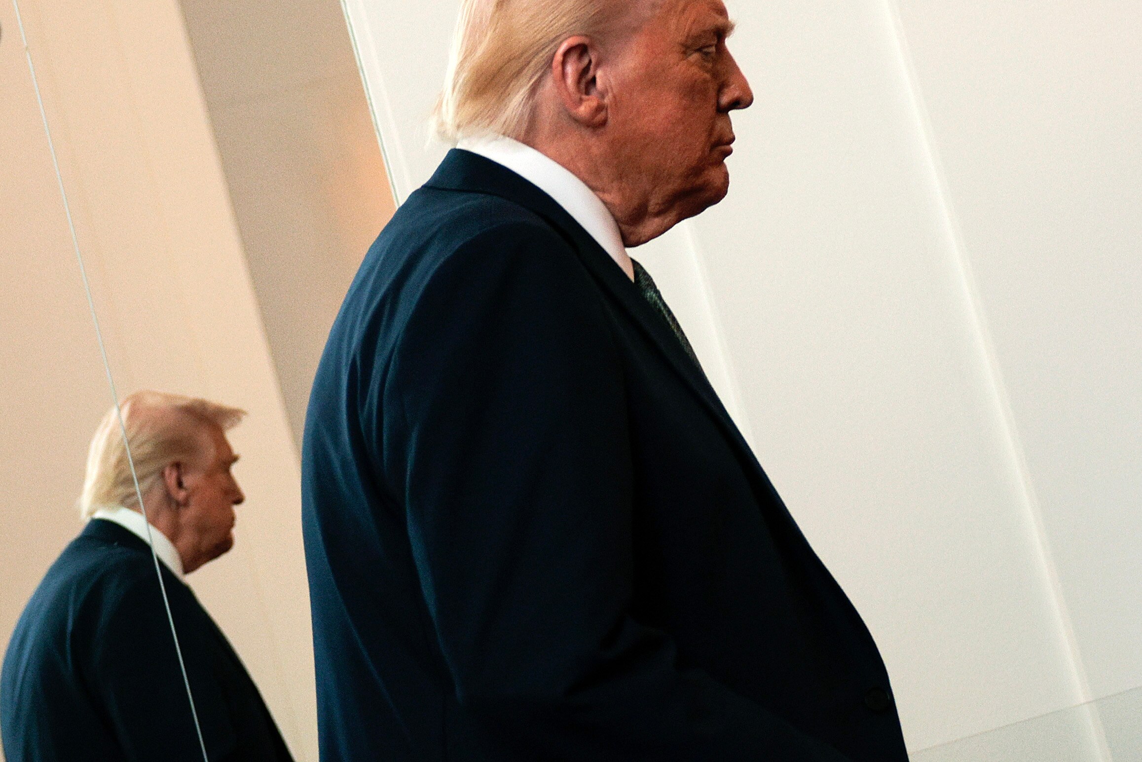 WASHINGTON, DC - MARCH 17: U.S. President Donald Trump departs after speaking with reporters in the Grand Foyer during a tour at the John F. Kennedy Center for the Performing Arts after leading a board meeting on March 17, 2025 in Washington, DC. After shunning the annual Kennedy Center Honors during his first term in the White House, Trump fired the center’s president, removed the bipartisan board of Biden appointees and named himself Chairman of the storied music, theater and dance institution.