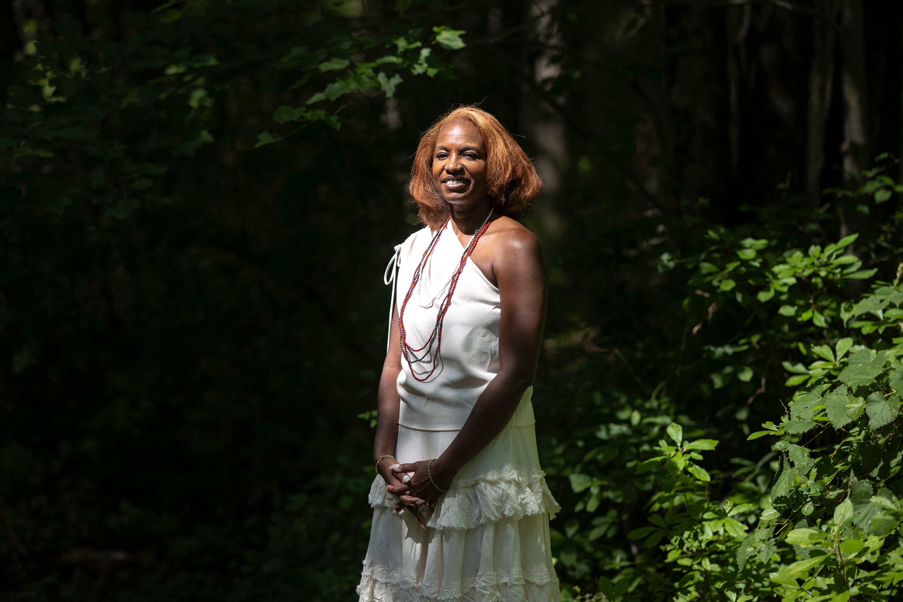 Angela Coleman, president and founder of Sisterhood Agenda, poses for a portrait on the property she aims to transform into housing in Middle River, Maryland, on Aug. 22, 2024.