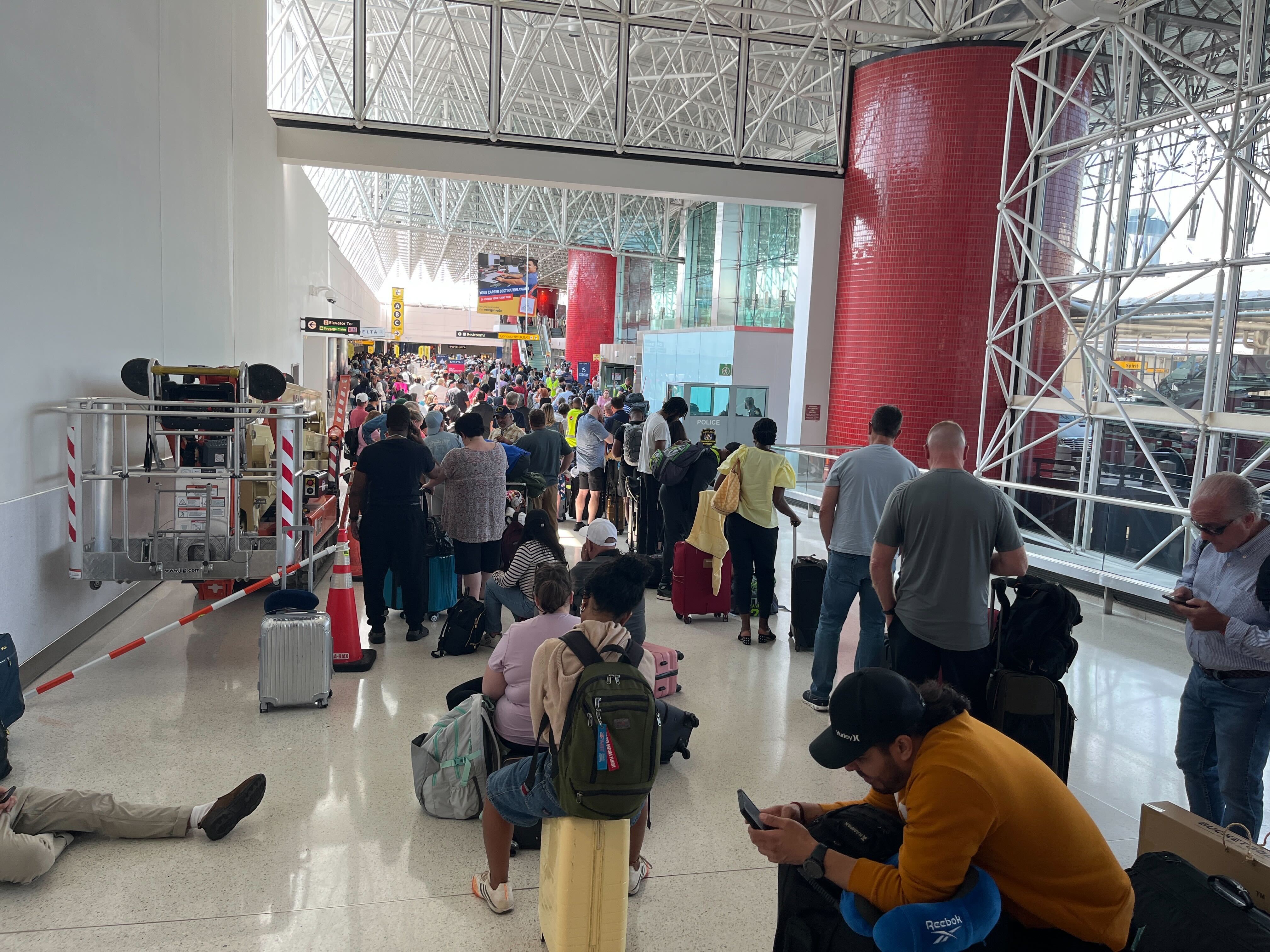 Crowds and long lines form inside BWI after a global tech outage grounded all flights on Friday, July 19, 2024.