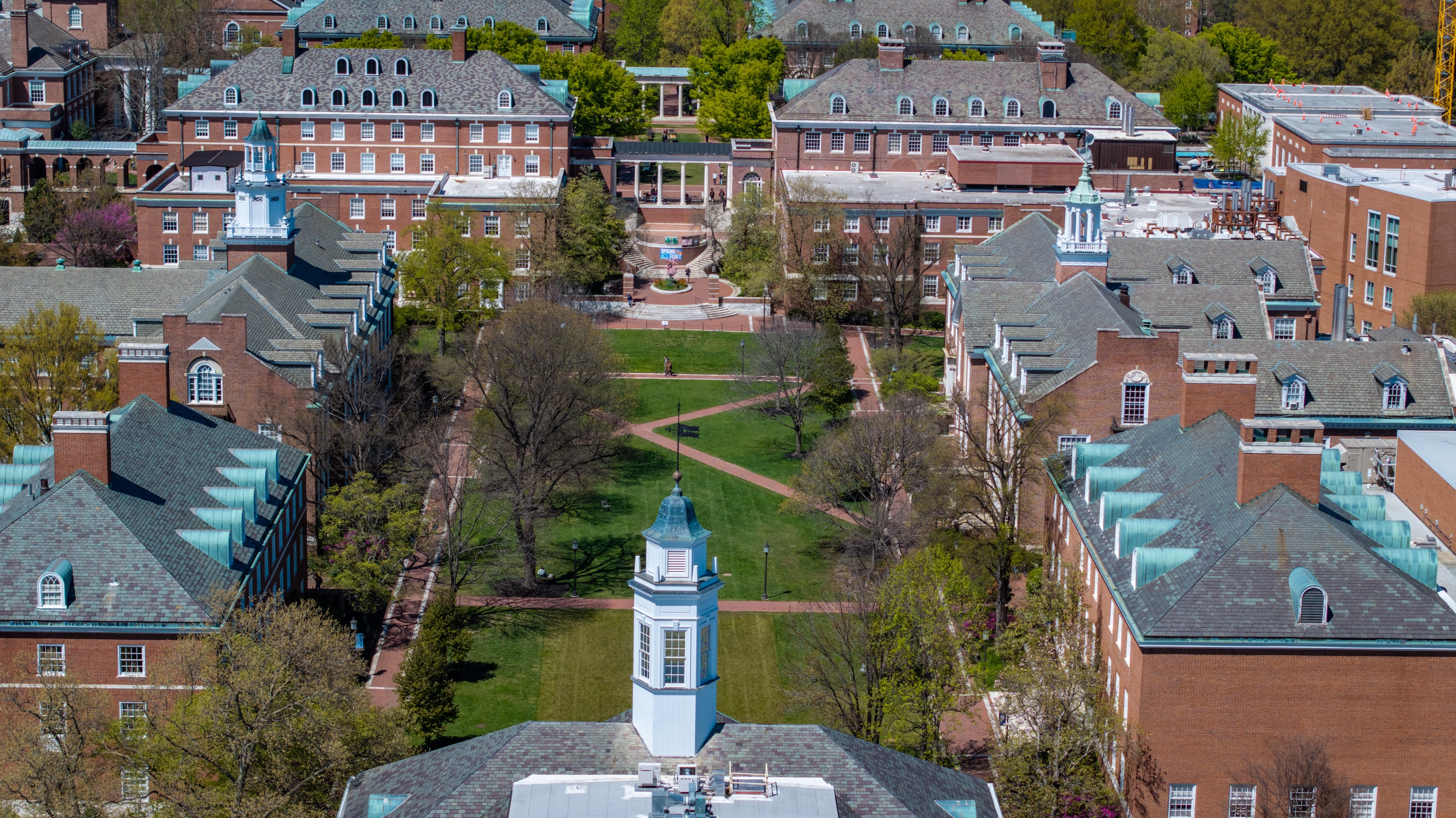 The Shriver Hall cupola, foreground, stands above the Wyman Quad on the Johns Hopkins University Homewood campus.