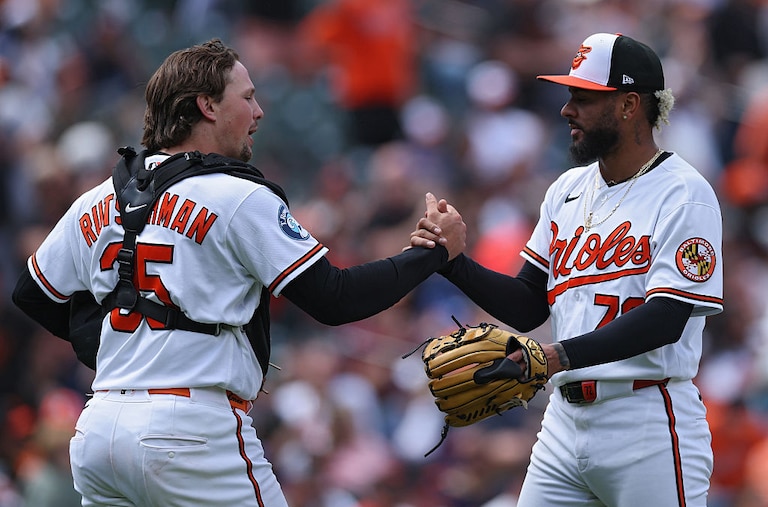 Orioles catcher Adley Rutschman celebrates with pitcher Jose Espada after defeating the Houston Astros in game one of a doubleheader Thursday.