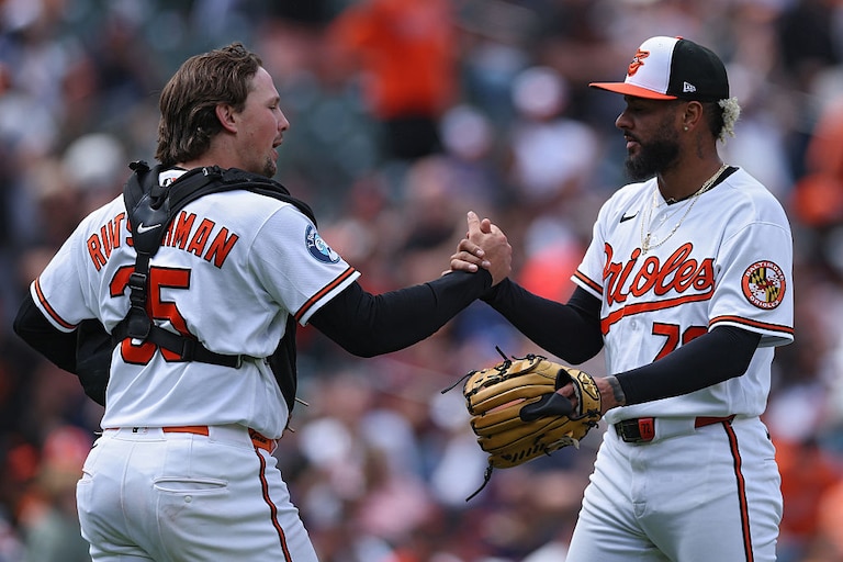 Orioles catcher Adley Rutschman celebrates with pitcher Jose Espada after defeating the Houston Astros in game one of a doubleheader Thursday.