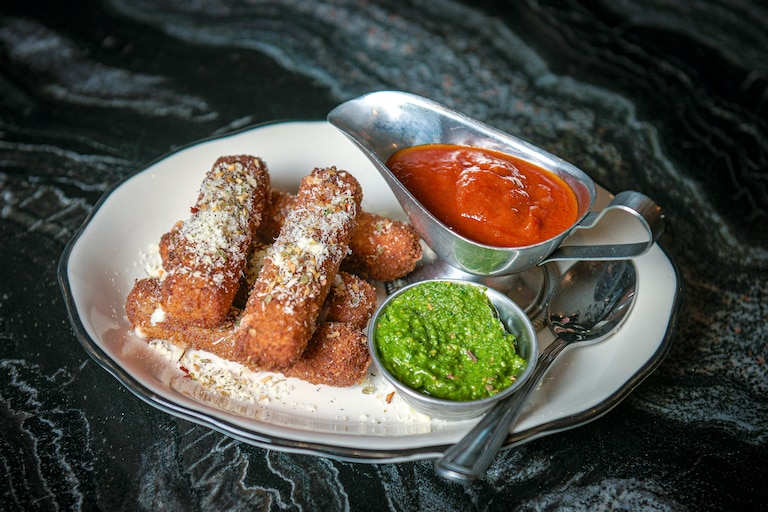 Chef Matt Adler has been hoping to add mozzarella sticks to the menu at Caruso’s for a few years. The ones now available at Caruso’s come with spicy pomodoro and fresh pesto dipping sauces.