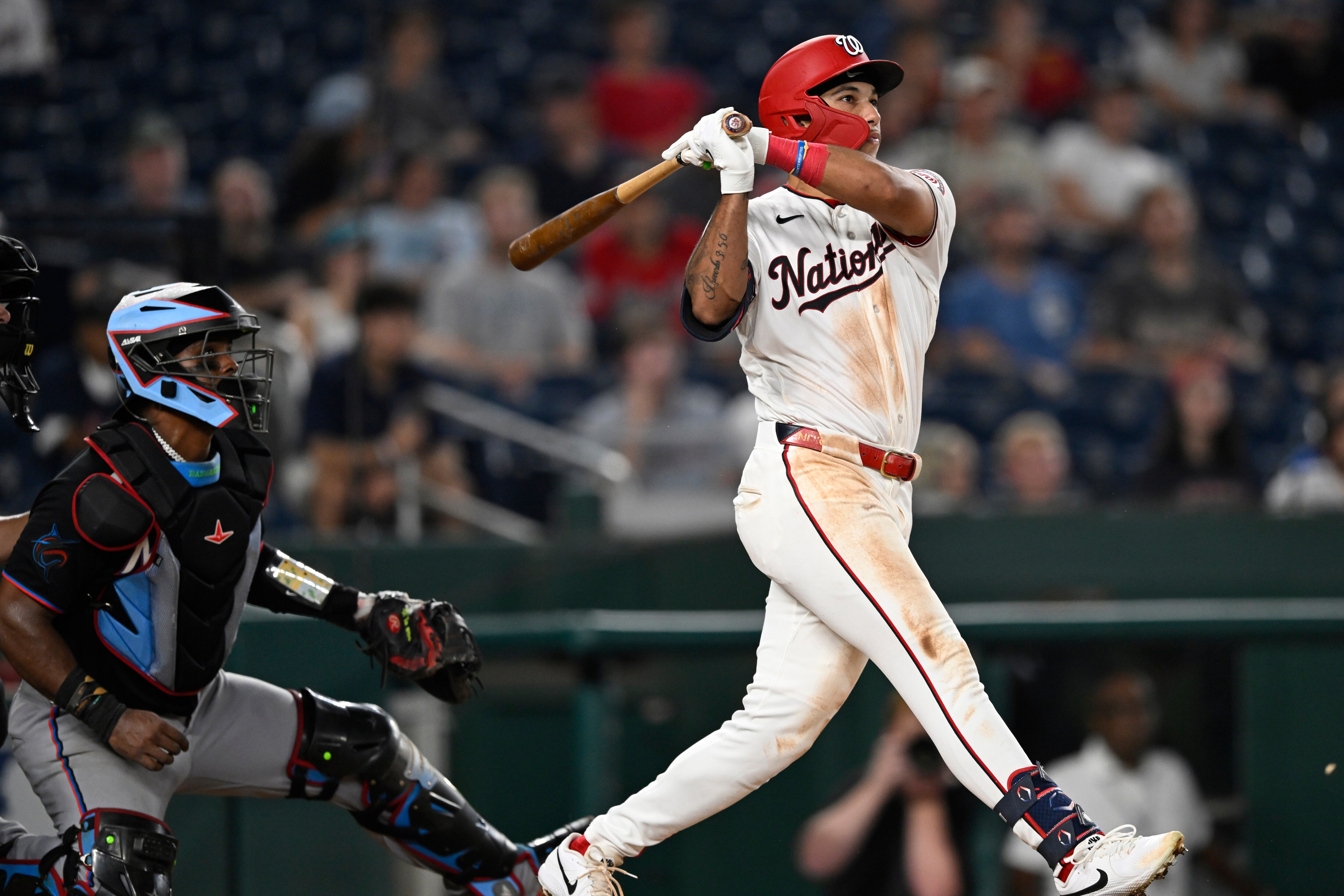 Washington Nationals' Daylen Lile watches his two-run home run go over the right field fence during the seventh inning.