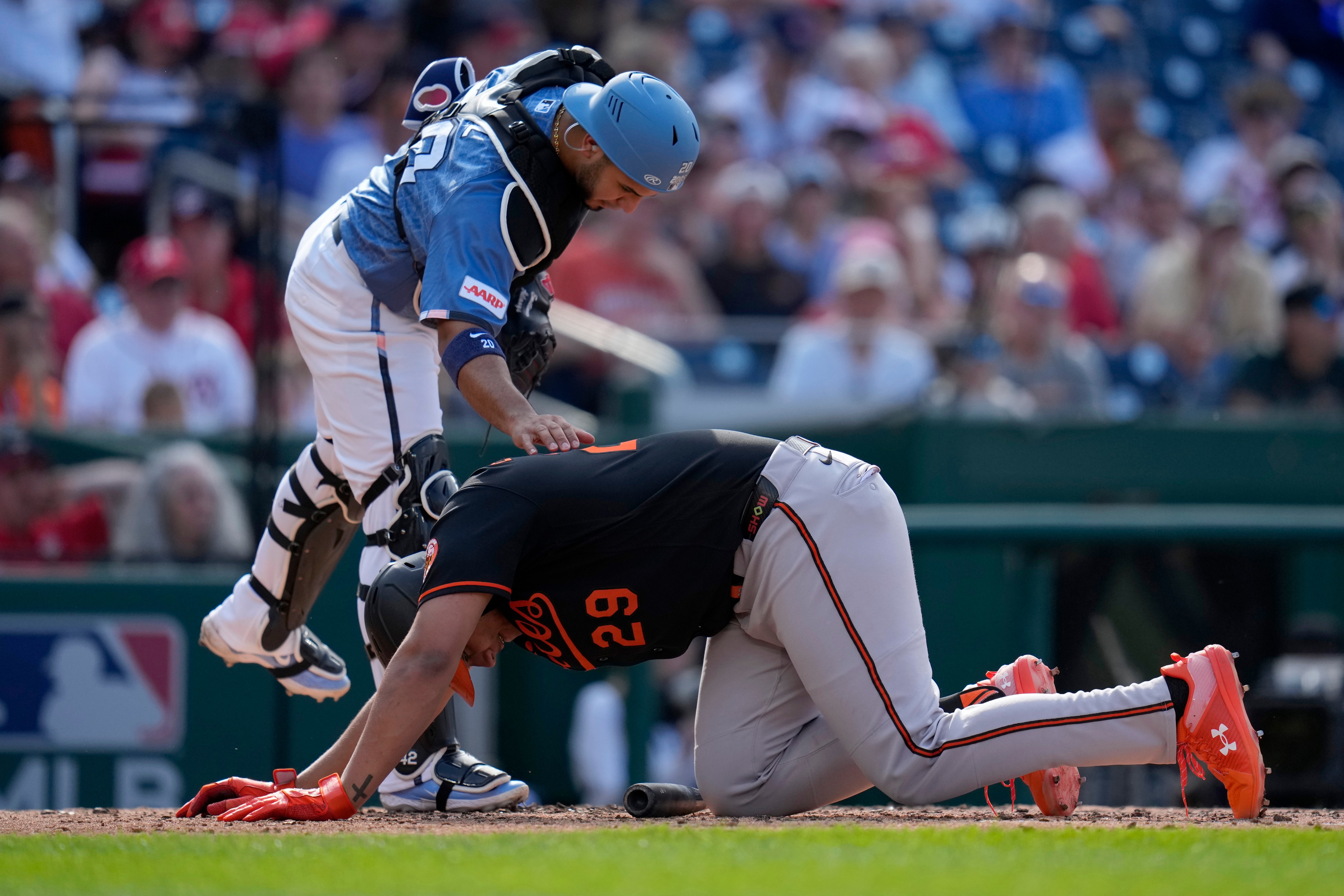 Keibert Ruiz of the Nationals checks on Samuel Basallo of the Orioles after Basallo was hit by a pitch he fouled off.
