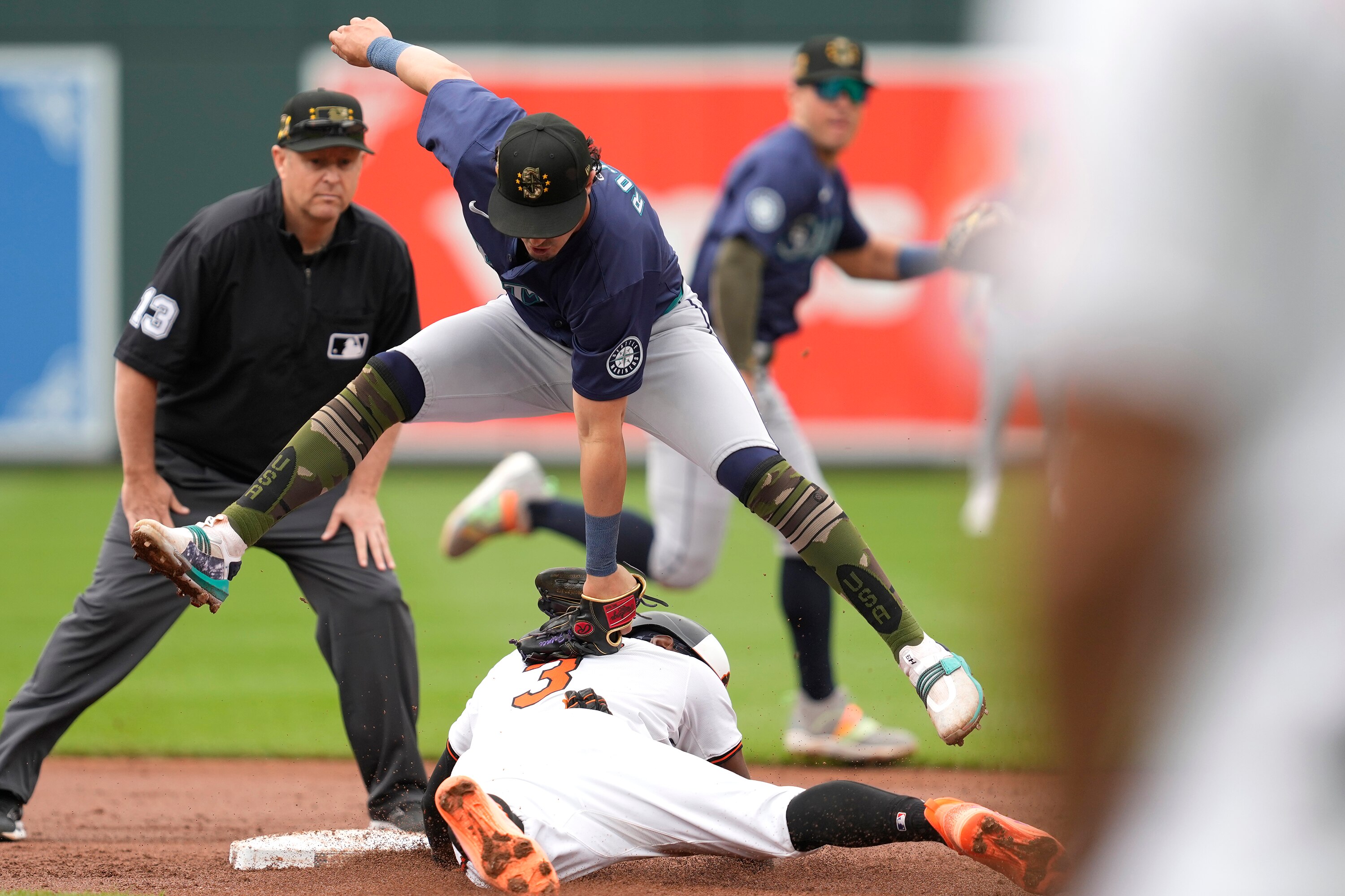 Jorge Mateo of the Orioles beats the tag by Josh Rojas of the Mariners to steal second base in the second inning Sunday at Camden Yards.