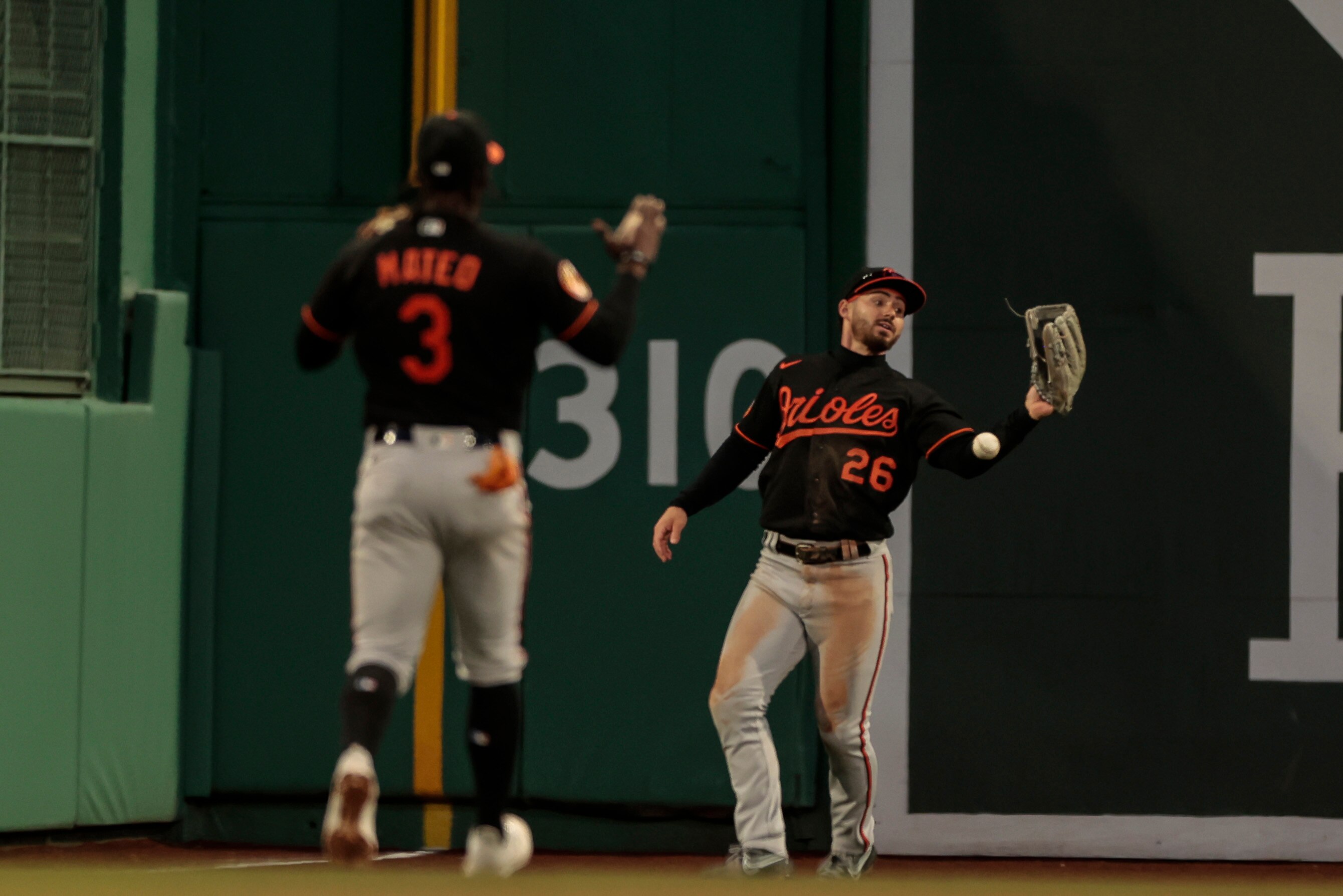 Ryan McKenna #26 of the Baltimore Orioles drops what would have been the game ending out during the ninth inning against the Boston Red Sox at Fenway Park on April 01, 2023 in Boston, Massachusetts.
