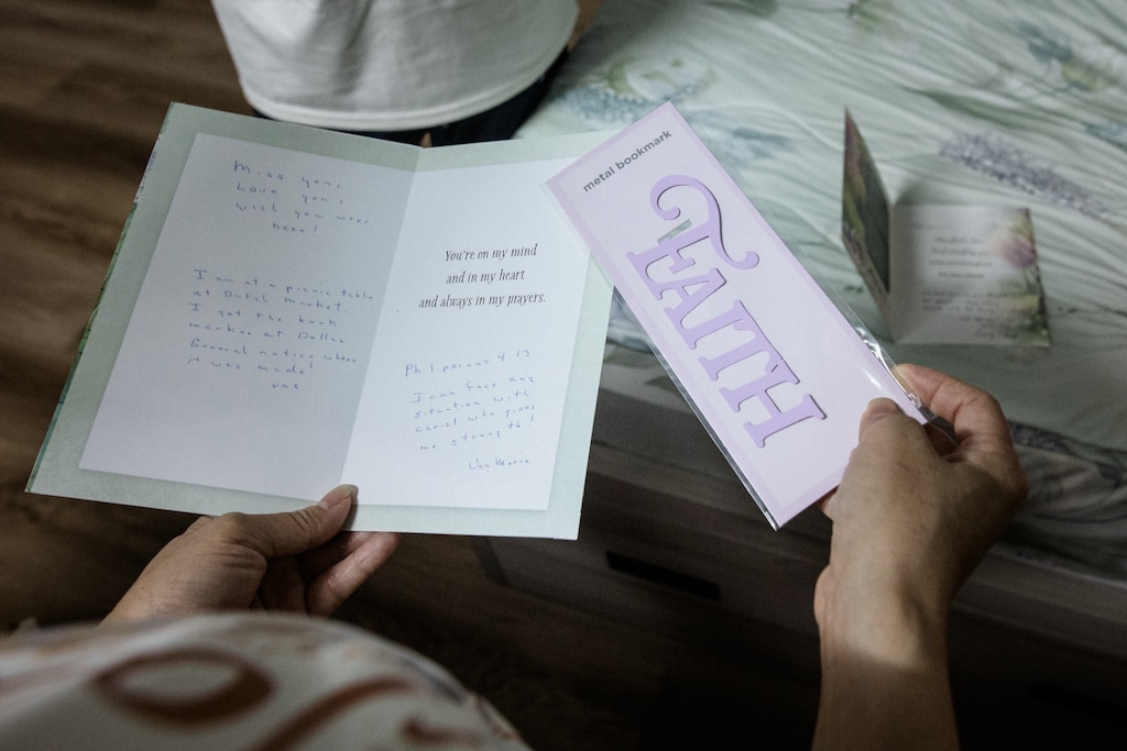 Dong Nai, Vietnam - Aug 1, 2026: Melissa Tran, 44, holds a card sent by one of her nail salon customers from the US on August 1, 2026. Rosem Morton for The Baltimore Banner