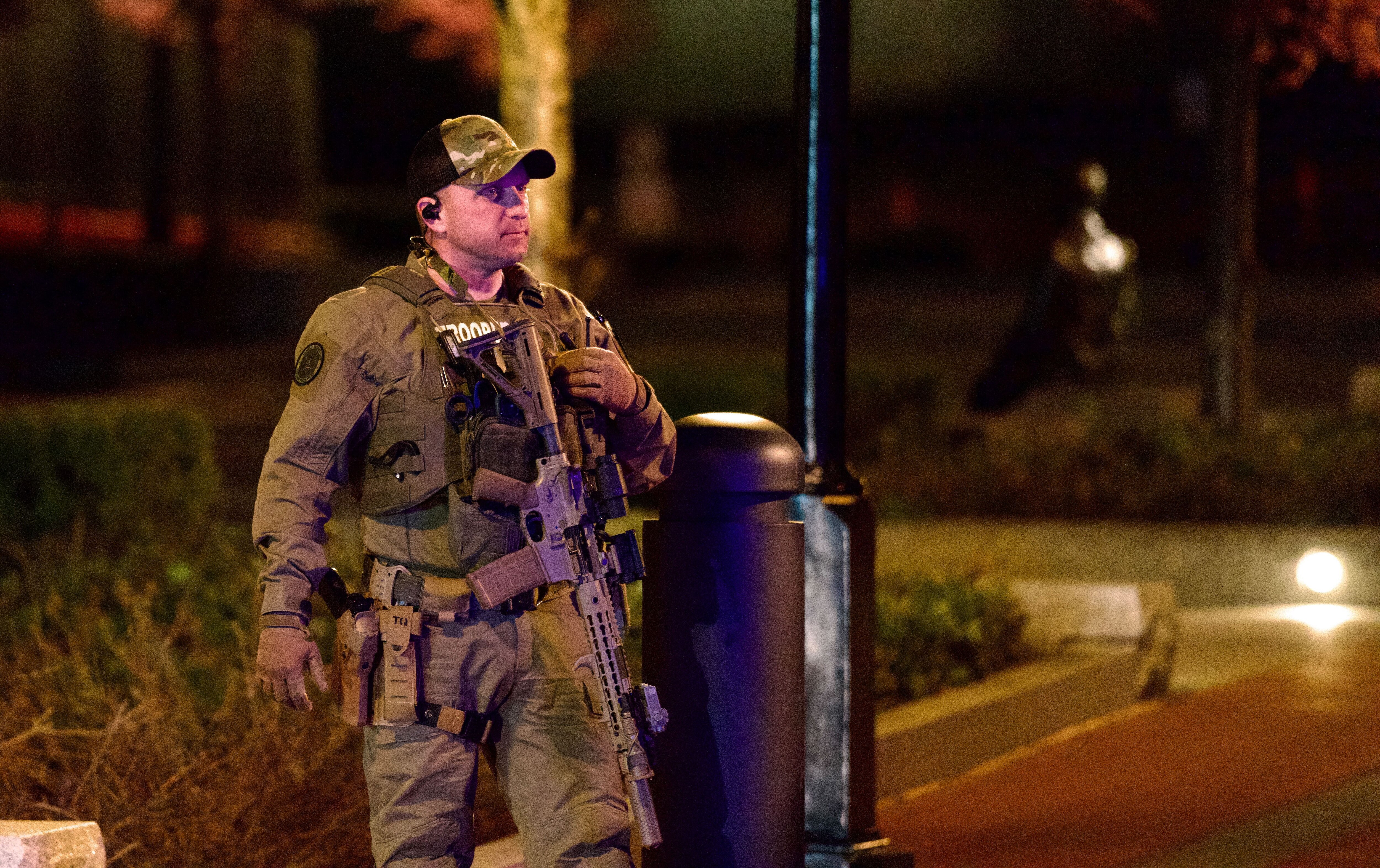 A police officer waits outside the Maryland State House in Annapolis on Feb. 29, 2024, after a threat prompted the evacuation of the building.