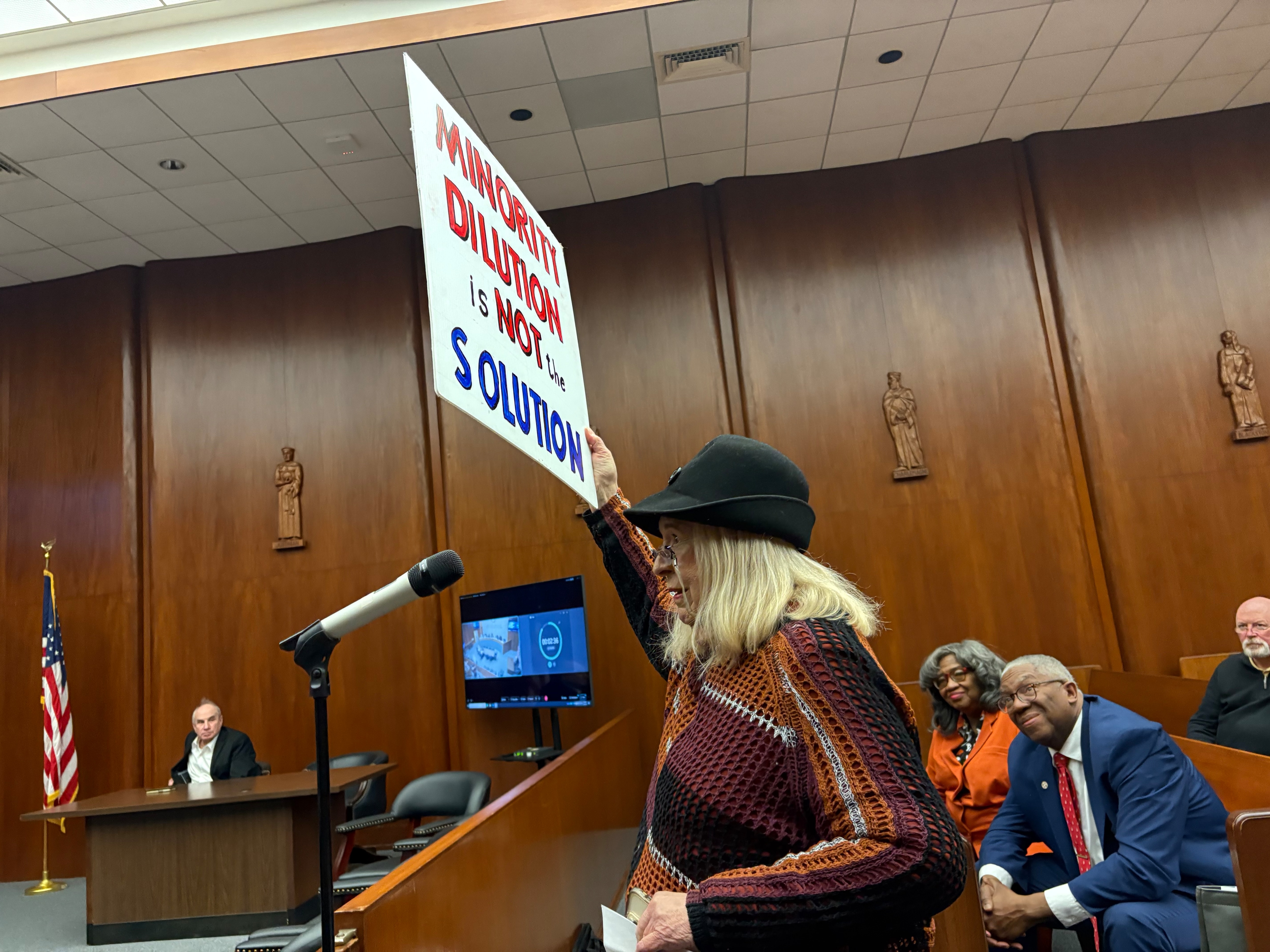 Baltimore County resident Ann George testifies that the County Council needs more minority representation. Looking on are Keith and Linda Dorsey, who have been advocating for more minority representation for many years.