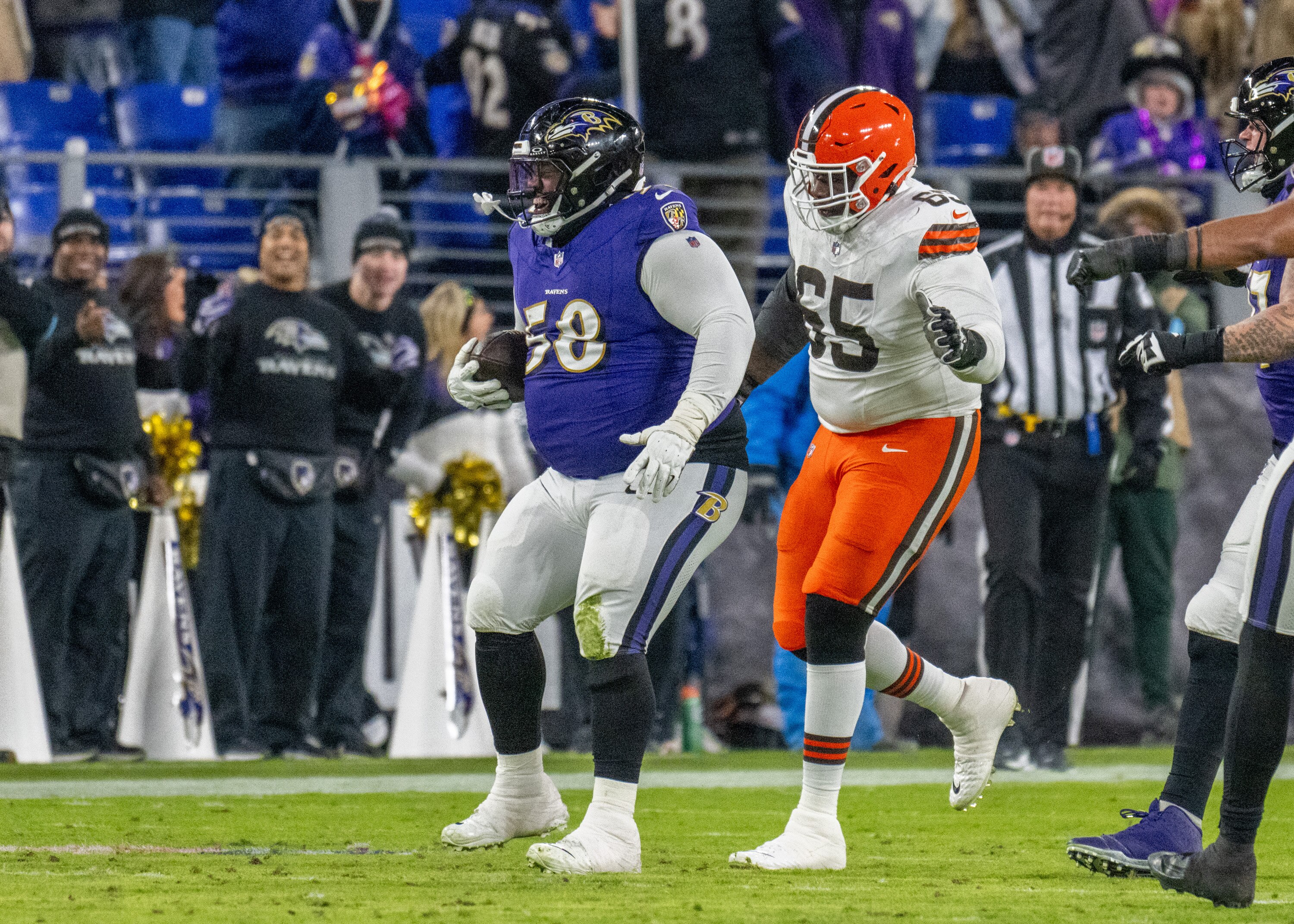 Baltimore Ravens defensive tackle Michael Pierce (58) intercepted a pass thrown by Cleveland Browns quarterback Bailey Zappe (2) in the 4th quarter as the Baltimore Ravens beat the Cleveland Browns 35 - 10 at M&T Bank Stadium on Saturday, January 4, 2025.