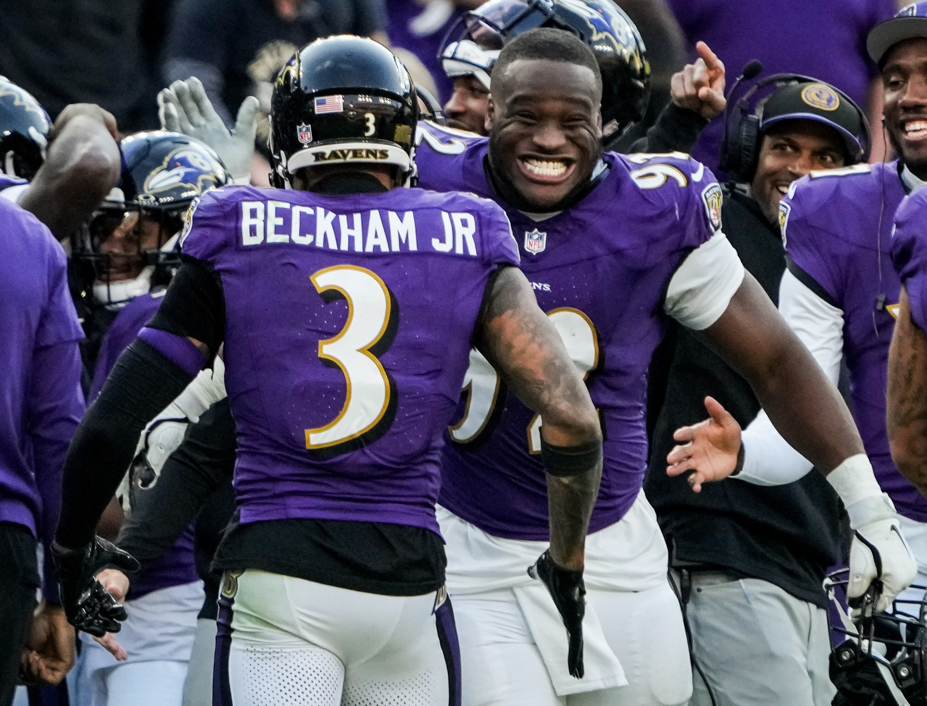 Ravens defensive tackle Justin Madubuike (92) congratulates Odell Beckham Jr. after the wide receiver's first touchdown as a Raven, which put the finishing touch on Sunday's 37-3 win over the Seattle Seahawks.
