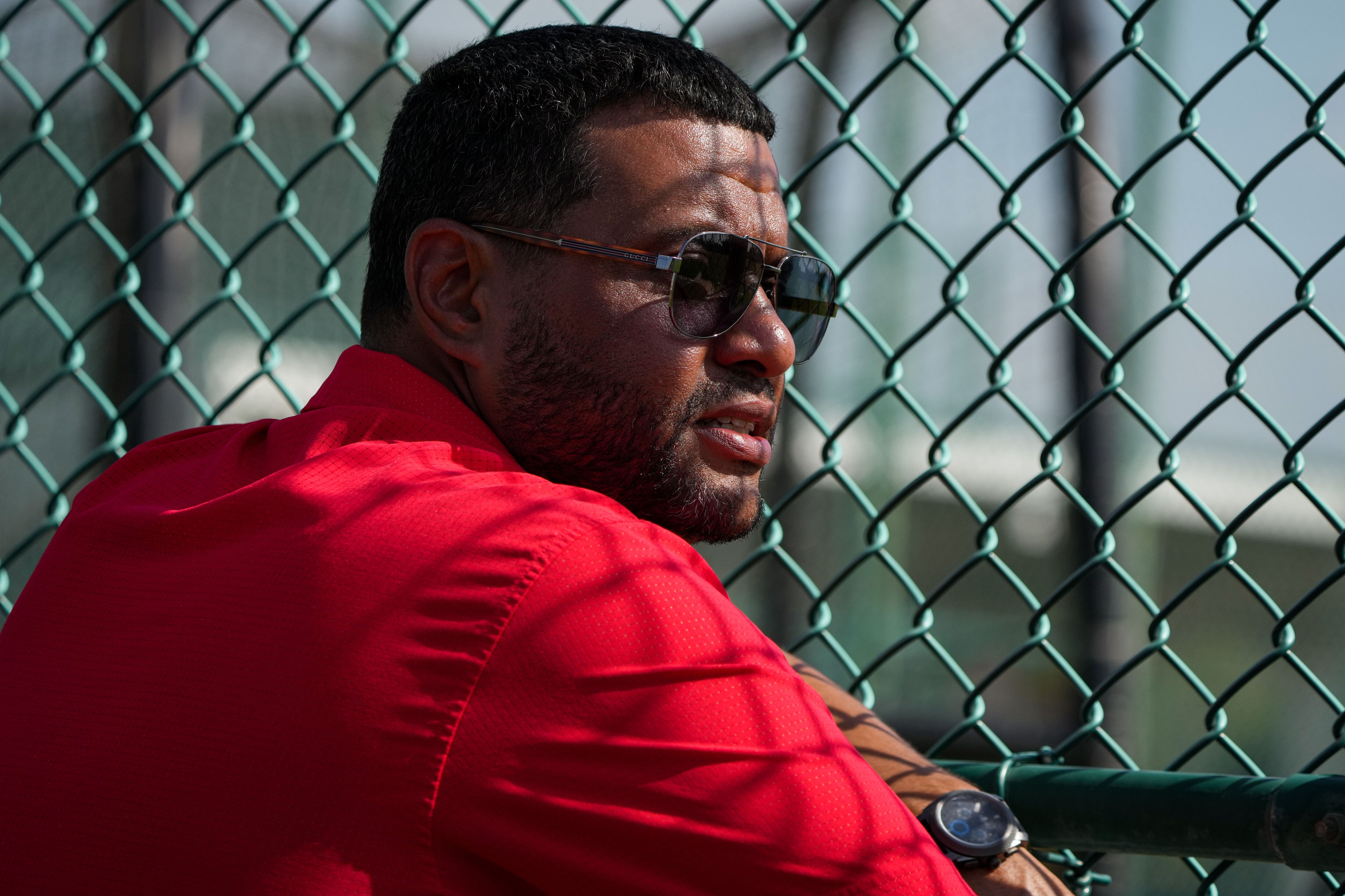 Koby Perez, vice president of international scouting, observes practice at Ed Smith Stadium in Sarasota, Florida, on Feb. 24, 2023.