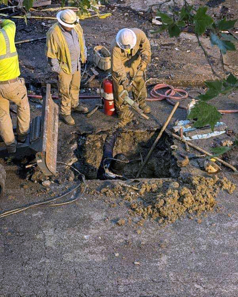 THURSDAY, MAY 28, 2026 - Workers dig up and work on gas lines at the site of the fatal house fire in the 2200 block of Guilford Avenue in Barclay. The three-alarm fire occurred on Thursday.