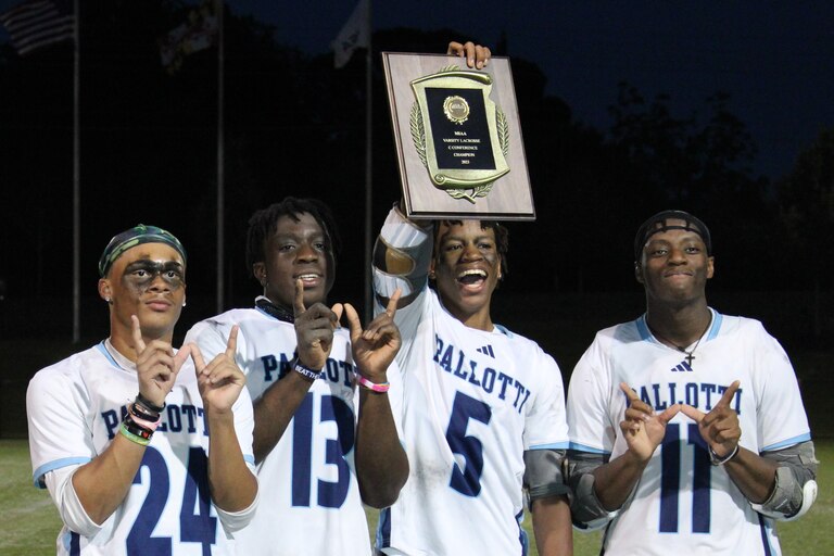 St. Vincent Pallotti's Amir Young holds up the MIAA C Conference lacrosse championship plaque alongside fellow captains Jace Wiggins (left), Ade Adeyemo and Robert Mitchell Thursday evening. The Panthers defeated St. John's Catholic Prep at Tierney Field in Sparks for their first title since 2016.