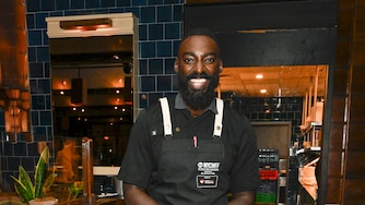 NEW YORK, NEW YORK - OCTOBER 19: Chef Eric Adjepong poses during the Food Network New York City Wine & Food Festival Dinner hosted by Eric Adjepong and Tiffani Faison as part of the Invesco Dining Series at The Standard Grill presented by Invesco QQQ on October 19, 2024 in New York City. (Photo by Daniel Zuchnik/Getty Images for NYCWFF)