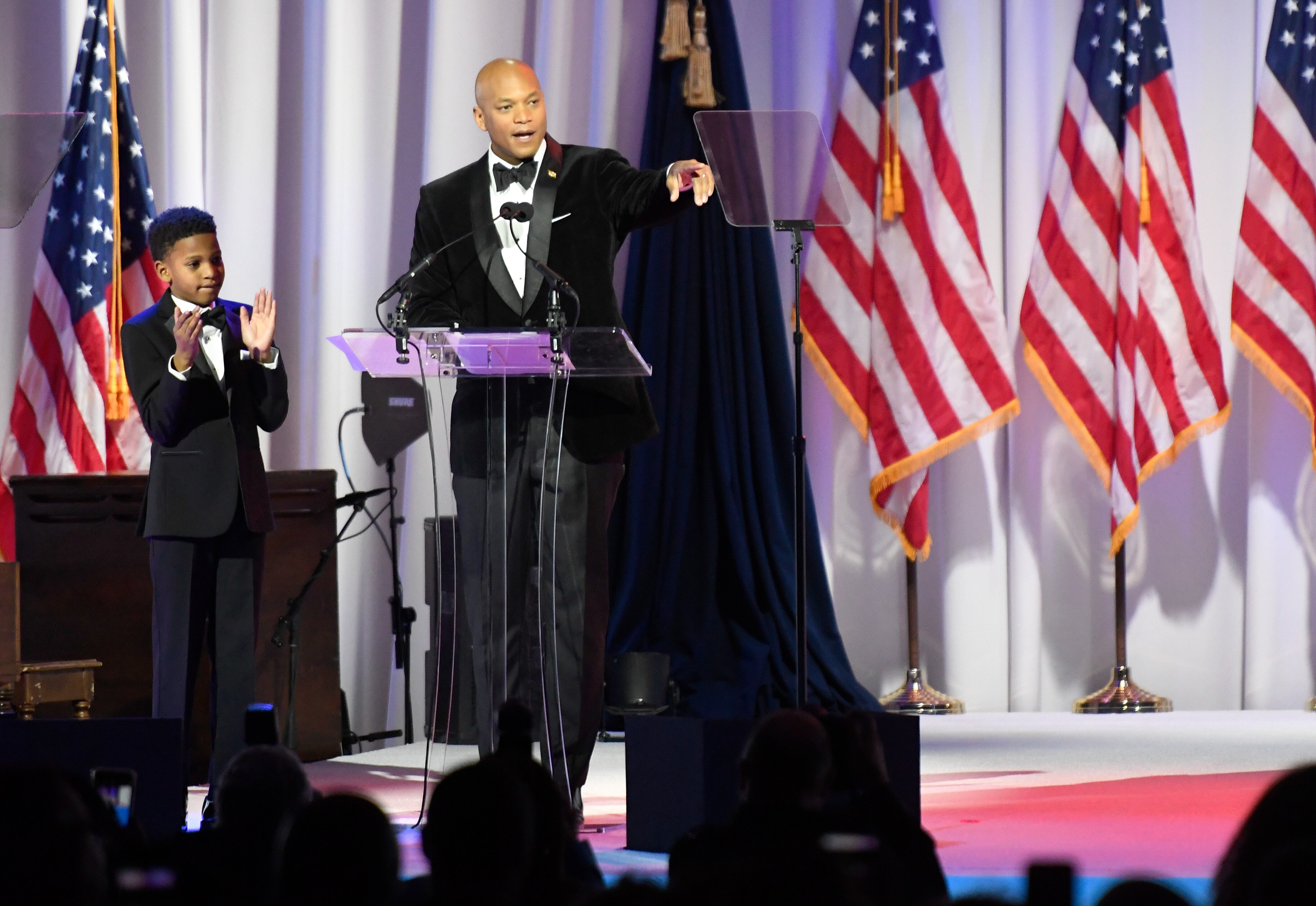 Gov. Wes Moore, with his son, James, 11, speaks during his inaugural ball, Wednesday, Jan. 18, 2023, in Baltimore.