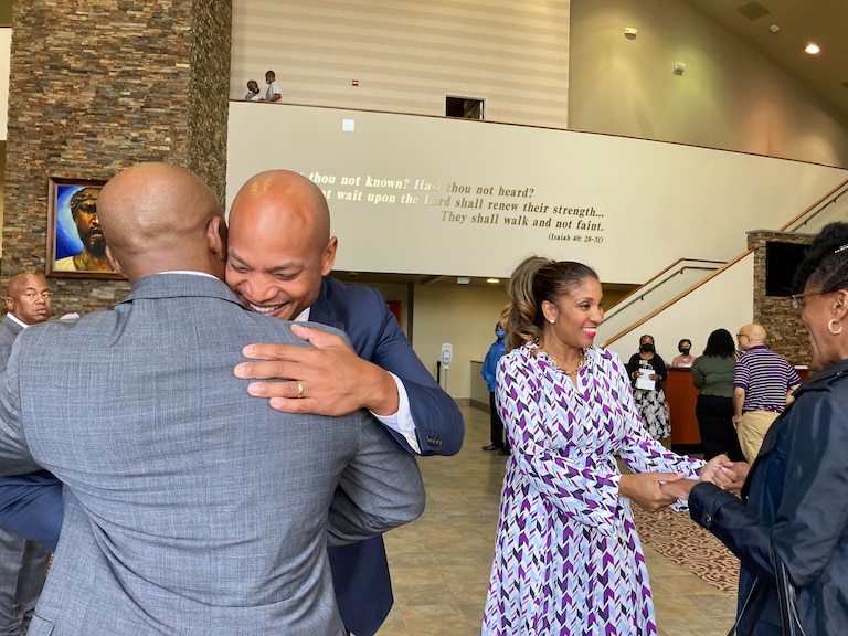 Maryland's Democratic nominee for governor Wes Moore, left, and his wife, Dawn Flythe Moore, greet worshippers at Mt. Ennon Baptist Church in Clinton on Sunday, Nov. 6, 2022. Ahead of Tuesday's Election Day, candidates are busy making their final pitches to voters.