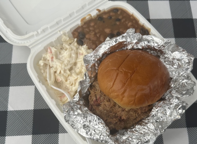 Tailgators 2U serves up heaping portions of pulled pork with beans and coleslaw at the Montgomery County fair on Aug. 14, 2026.