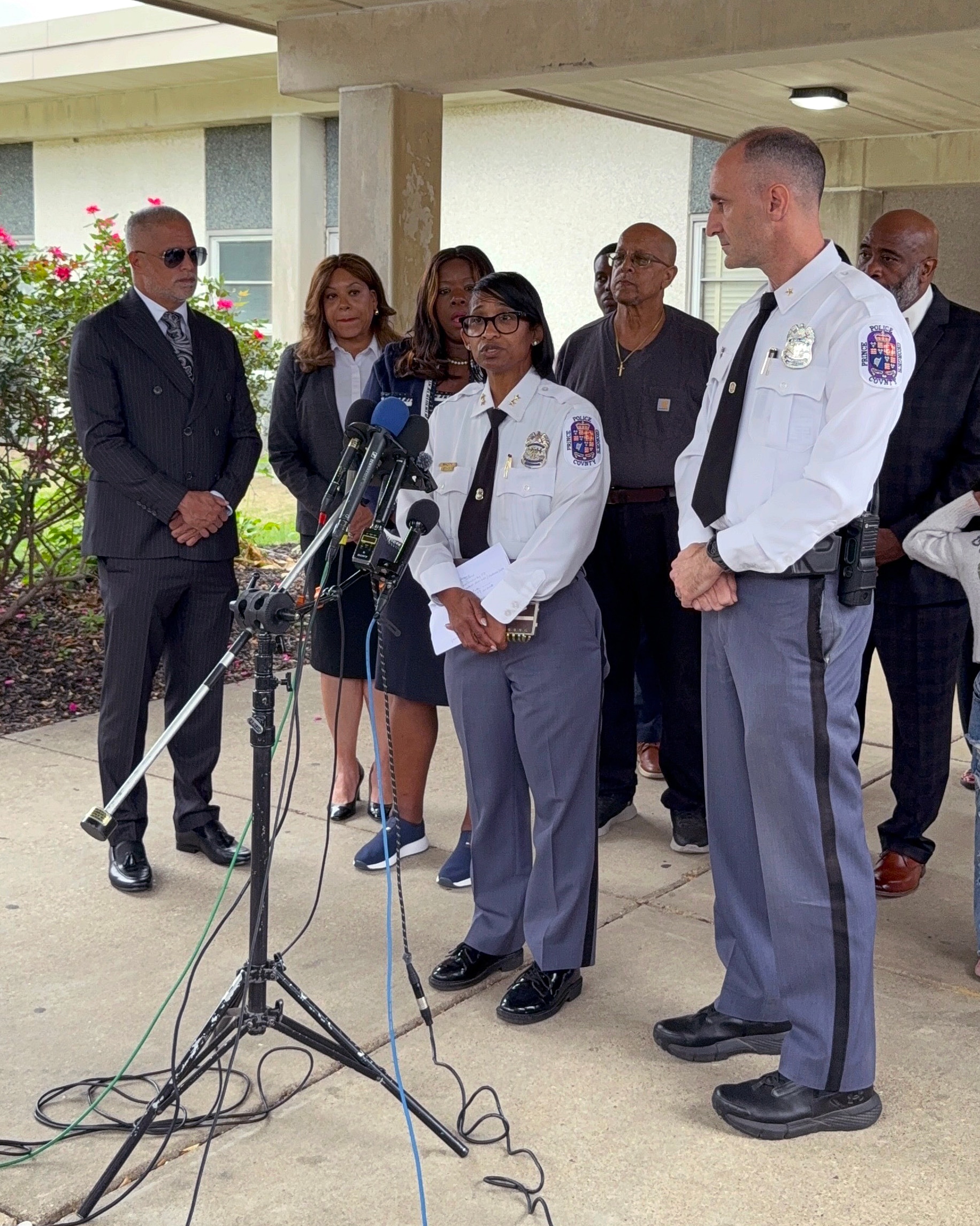 Deputy Shief Shawné Waddy and Asst. Dep. Chief Jason Fisher address the media in front of Arrowhead Elementary School during a news conference about a public suicide death.