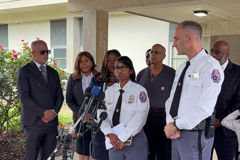 Deputy Shief Shawné Waddy and Asst. Dep. Chief Jason Fisher address the media in front of Arrowhead Elementary School during a news conference about a public suicide death.