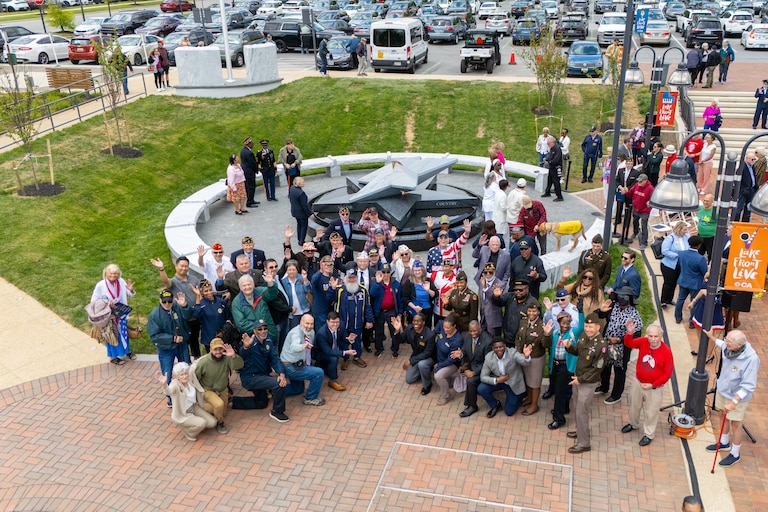 MAY 14, 2026 — Today, the Howard County Veterans Foundation opened and dedicated the Howard County Veterans and Military Families Monument at Vivian C. “Millie” Bailey Park in downtown Columbia, Maryland. Veteran service organization and community leaders spoke and participated in a ribbon cutting, and a Fort Meade Marine Corps detail raised the flag over the monument for the first time.