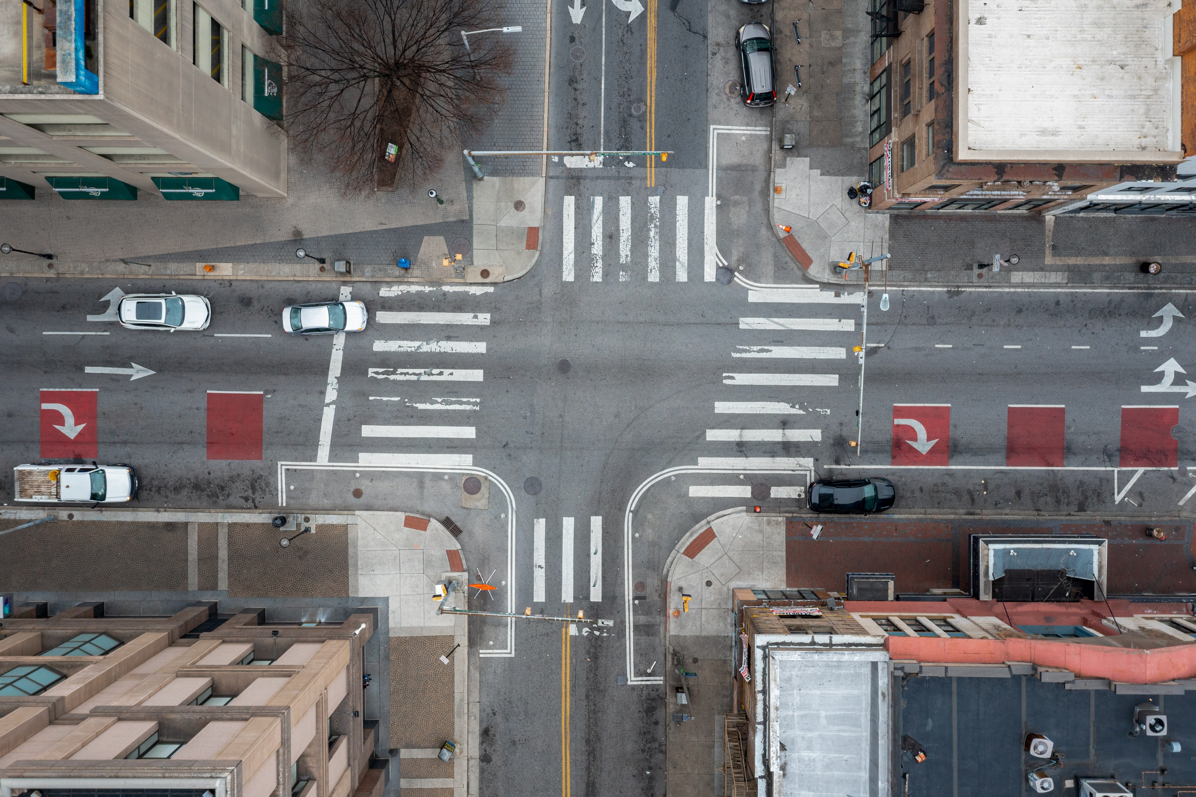 An aerial view of a downtown Baltimore intersection, Holiday and East Baltimore streets, taken with a drone on Friday, March 17, 2023.