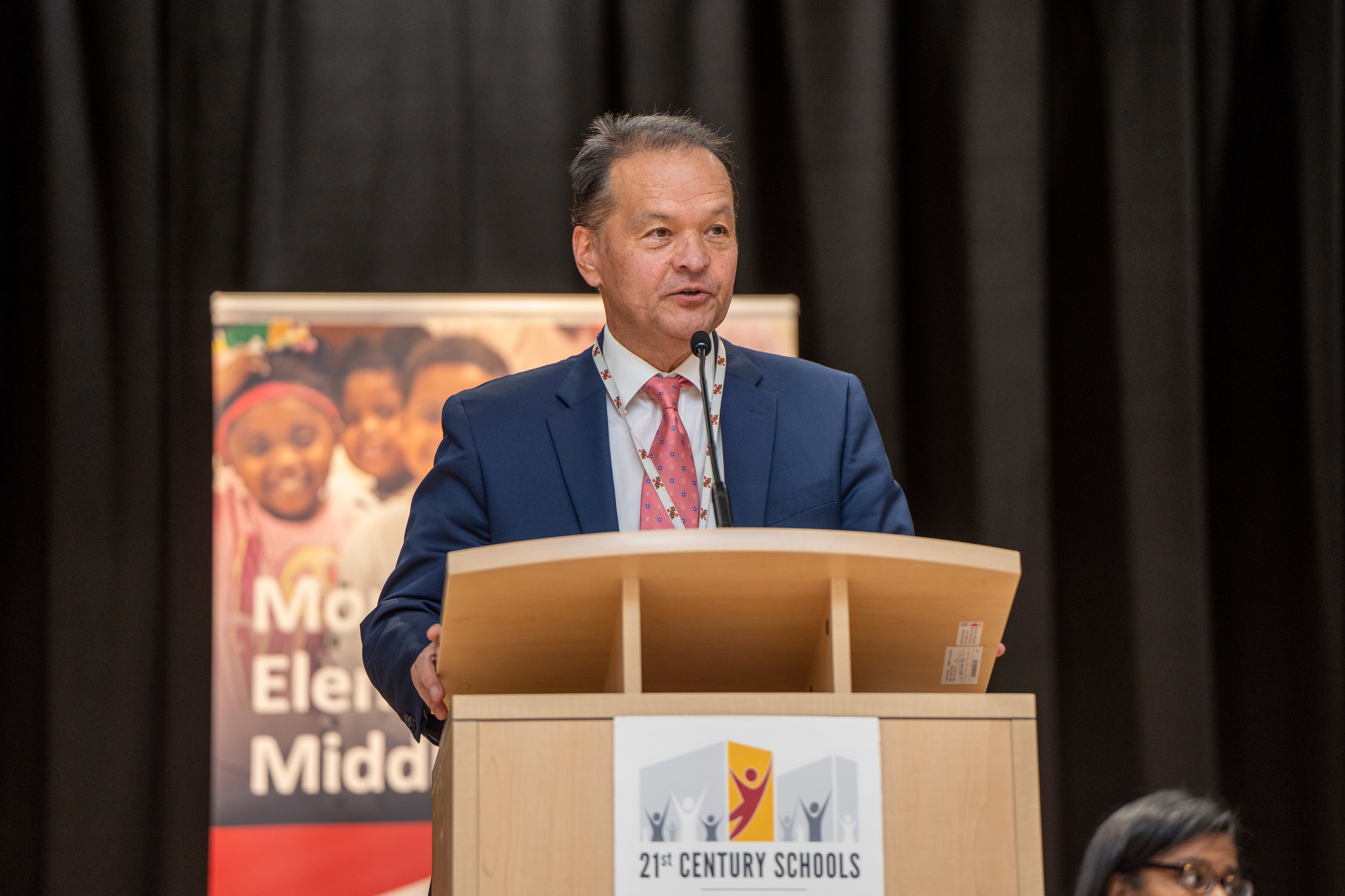 Michael Frenz, speaking here at a ribbon-cutting at Montebello Elementary/Middle School in 2022, plans to retire in April.