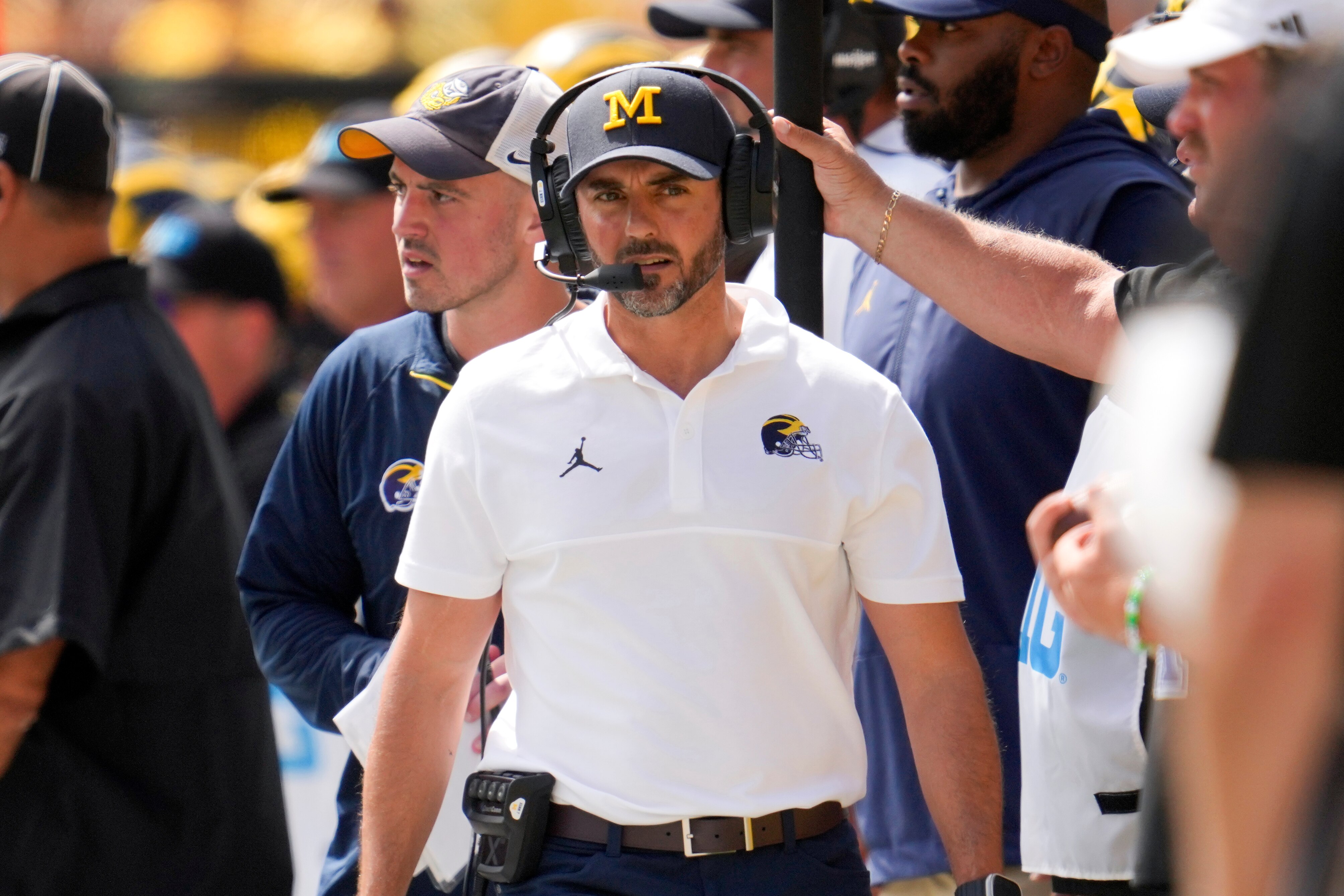 FILE -Michigan defensive coordinator Jesse Minter watches against East Carolina in the first half of an NCAA college football game in Ann Arbor, Mich., Saturday, Sept. 2, 2023.