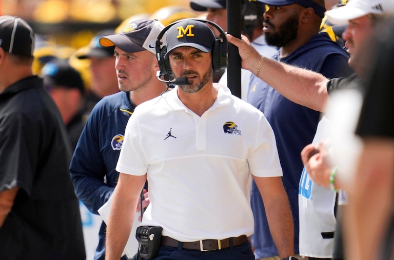 FILE -Michigan defensive coordinator Jesse Minter watches against East Carolina in the first half of an NCAA college football game in Ann Arbor, Mich., Saturday, Sept. 2, 2023.