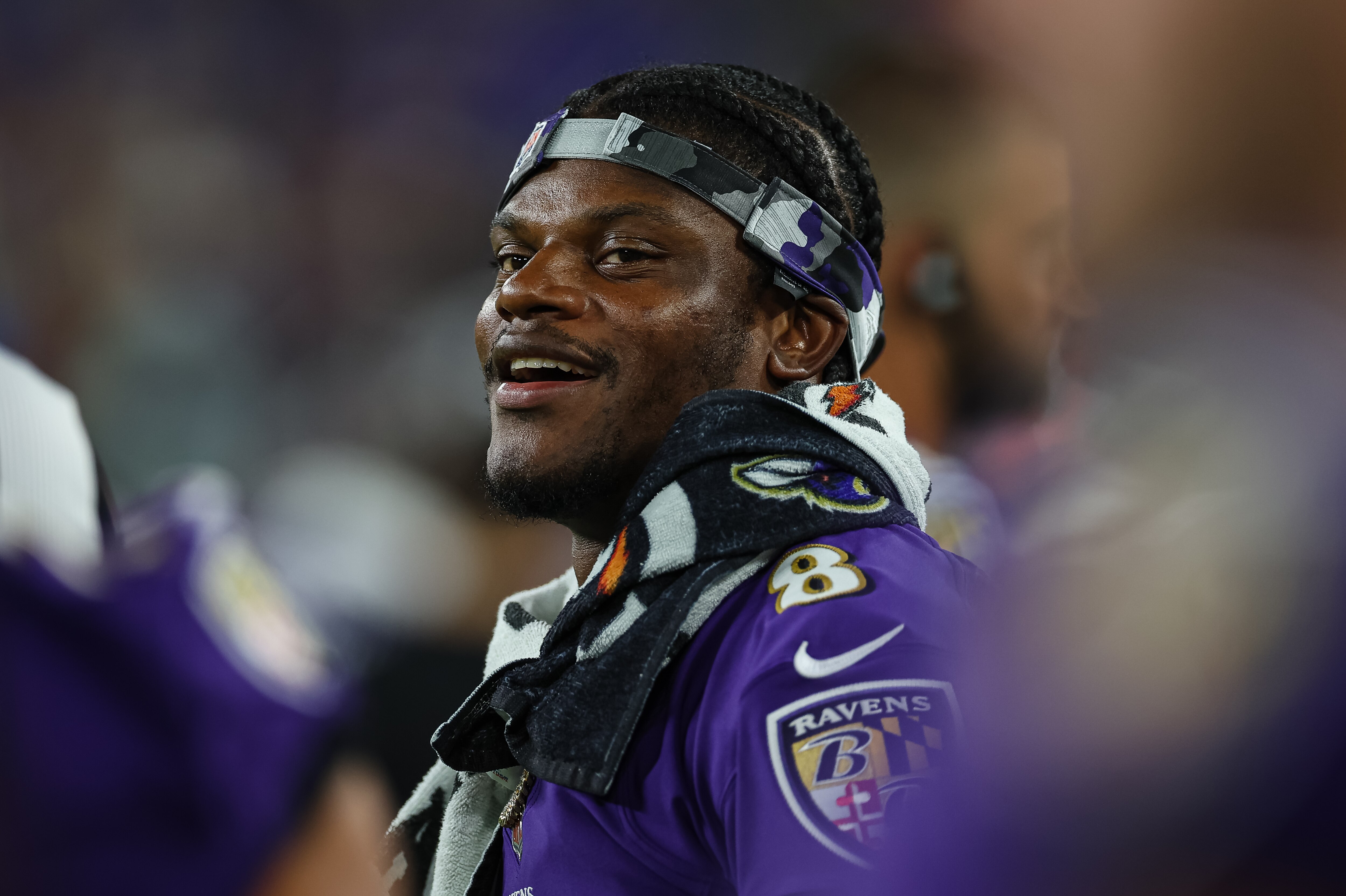 BALTIMORE, MD - AUGUST 11: Lamar Jackson #8 of the Baltimore Ravens looks on from the sidelines during the second half against the Tennessee Titans at M&T Bank Stadium on August 11, 2022 in Baltimore, Maryland. (Photo by Scott Taetsch/Getty Images)