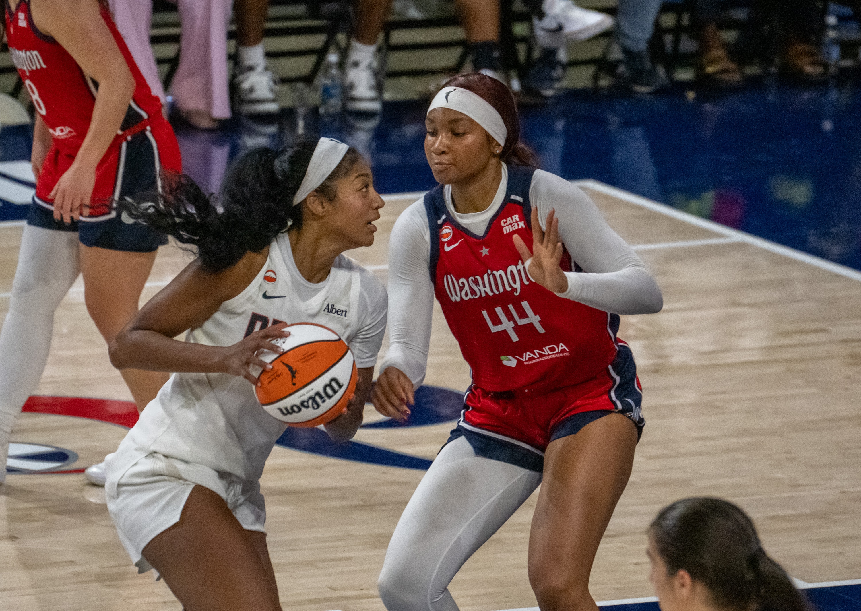 Dream forward Angel Reese goes to the basket as Mystics forward Kiki Iriafen defends during the WNBA playoffs.