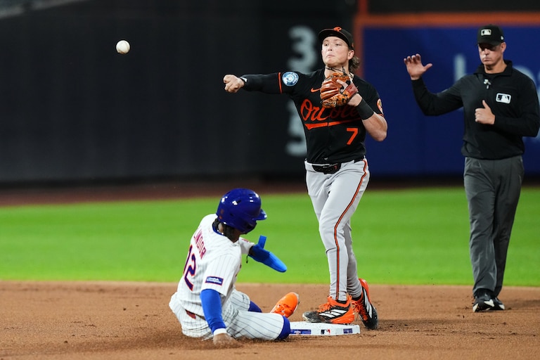 Baltimore Orioles' Jackson Holliday (7) throws out New York Mets' Bo Bichette at first base after foercing out Francisco Lindor (12) for a double play during the first inning of a baseball game Monday, Sept. 14, 2026, in New York. (AP Photo/Frank Franklin II)