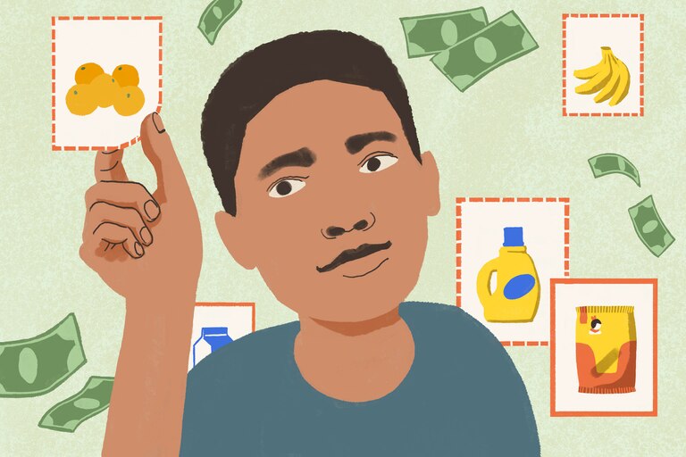 Boy clips a coupon, surrounded by dollar bills and coupons