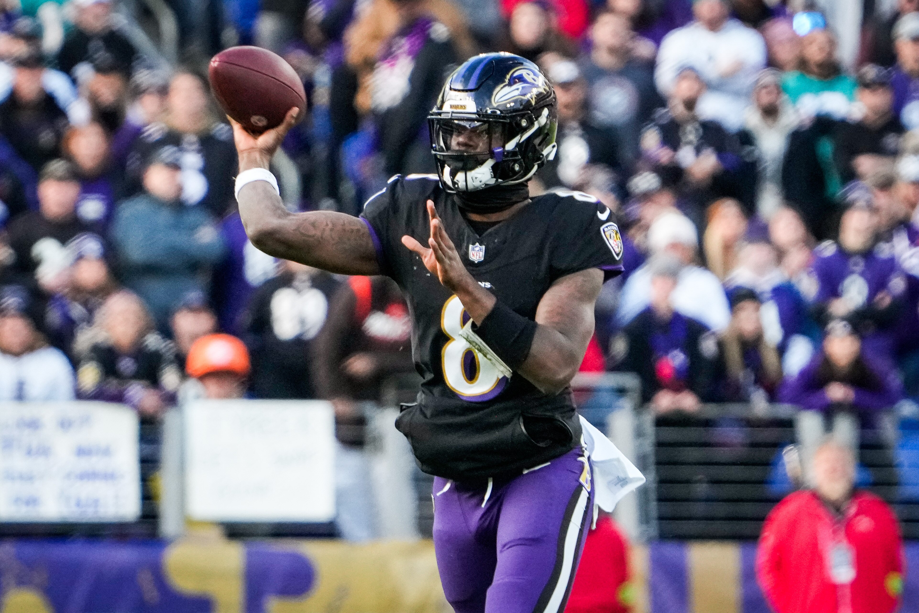 Baltimore Ravens quarterback Lamar Jackson (8) throws the ball during the second quarter against the Miami Dolphins at M&T Bank Stadium on Sunday, Dec. 31, 2023.