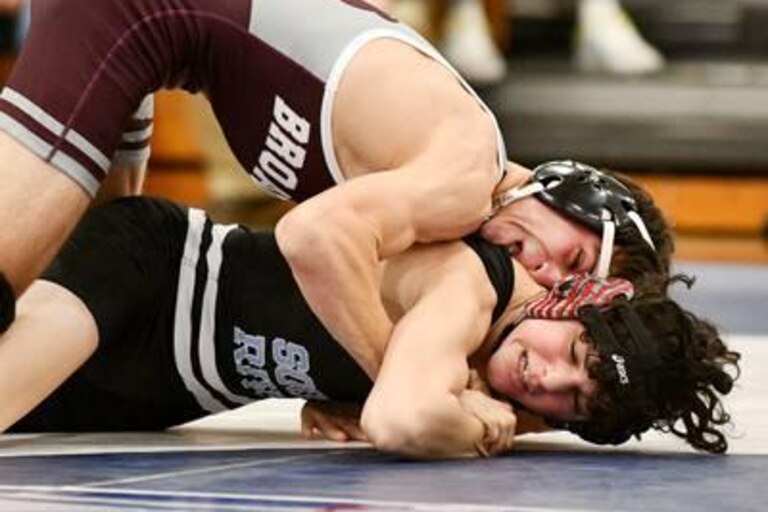 Broadneck's Ben Durkin (top) had his way with South River's Sam Travis during Wednesday's Anne Arundel County wrestling dual match. Durkin won by pin as the Bruins defeated the reigning Class 3A state champ Seahawks, 40-25, in Edgewater.