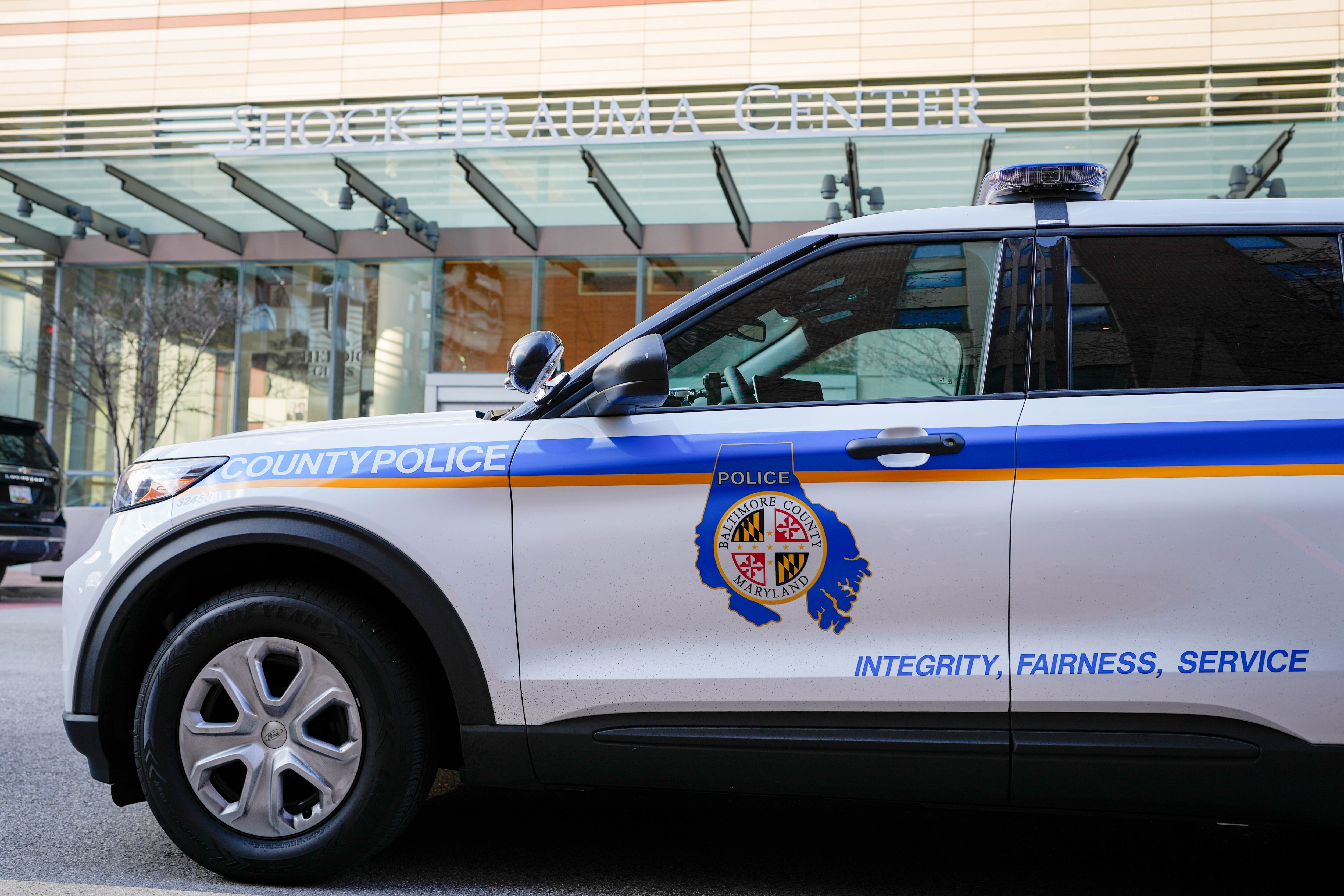 Baltimore County police arrested a 21-year-old woman for the death of a man and his dog after a crash last month, officials announced Tuesday.