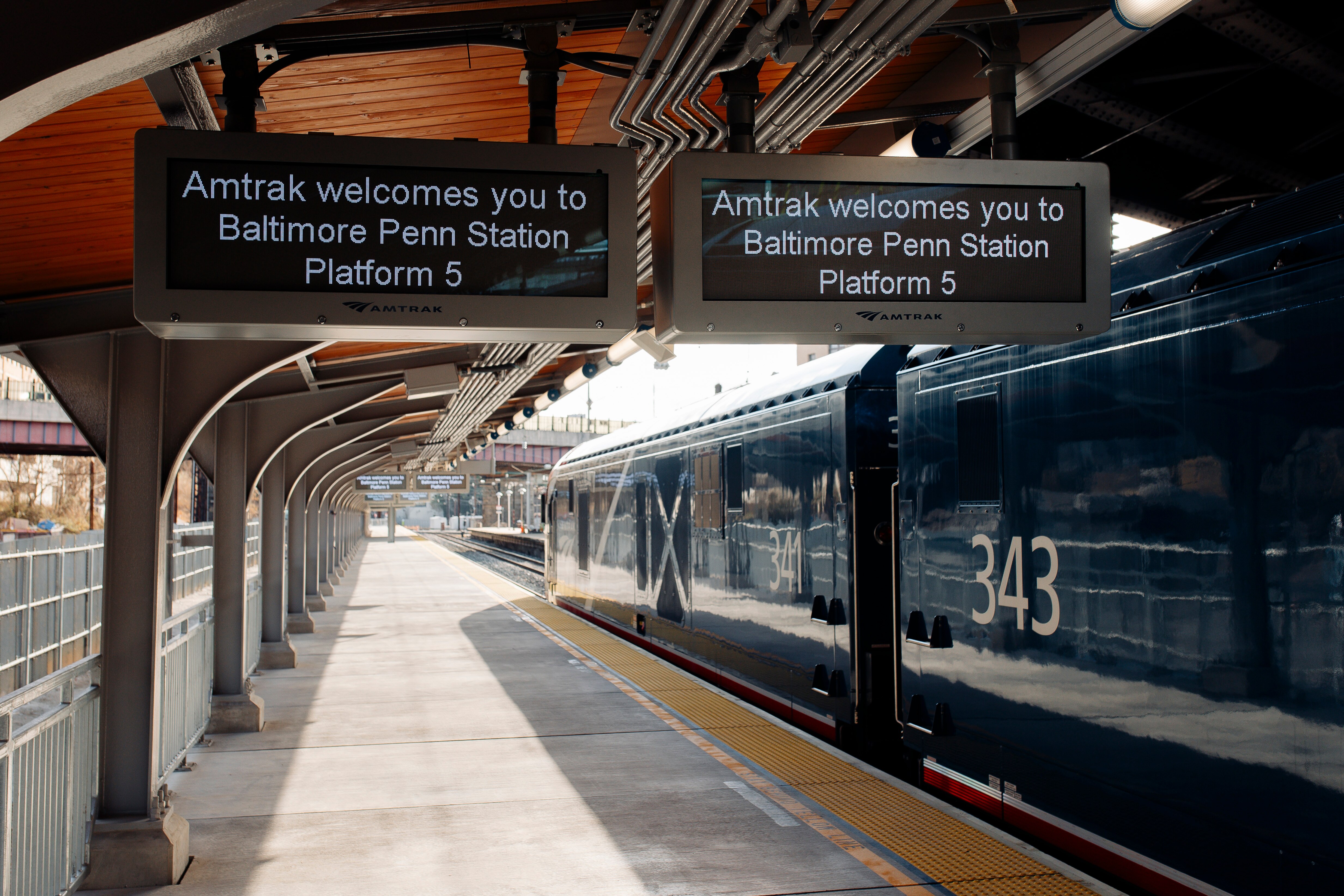 An Amtrak train idles alongside Penn Station’s newly constructed Platform 5 before a ceremonial ribbon-cutting for the platform on Monday, Jan. 29, 2024, in Baltimore.