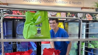 A Meritus Nutrition Services worker unloads bags of food into refrigerators at the Meritus Food Farmacy in the Robinwood Professional Center in Hagerstown.
