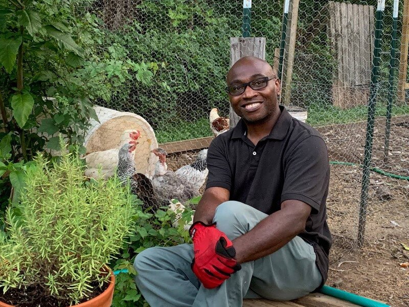 Ulysses Archie, Jr. seen here in his Irvington yard surrounded by his chickens, is a survivor of childhood trauma and a trainer in recognizing such trauma in communities.