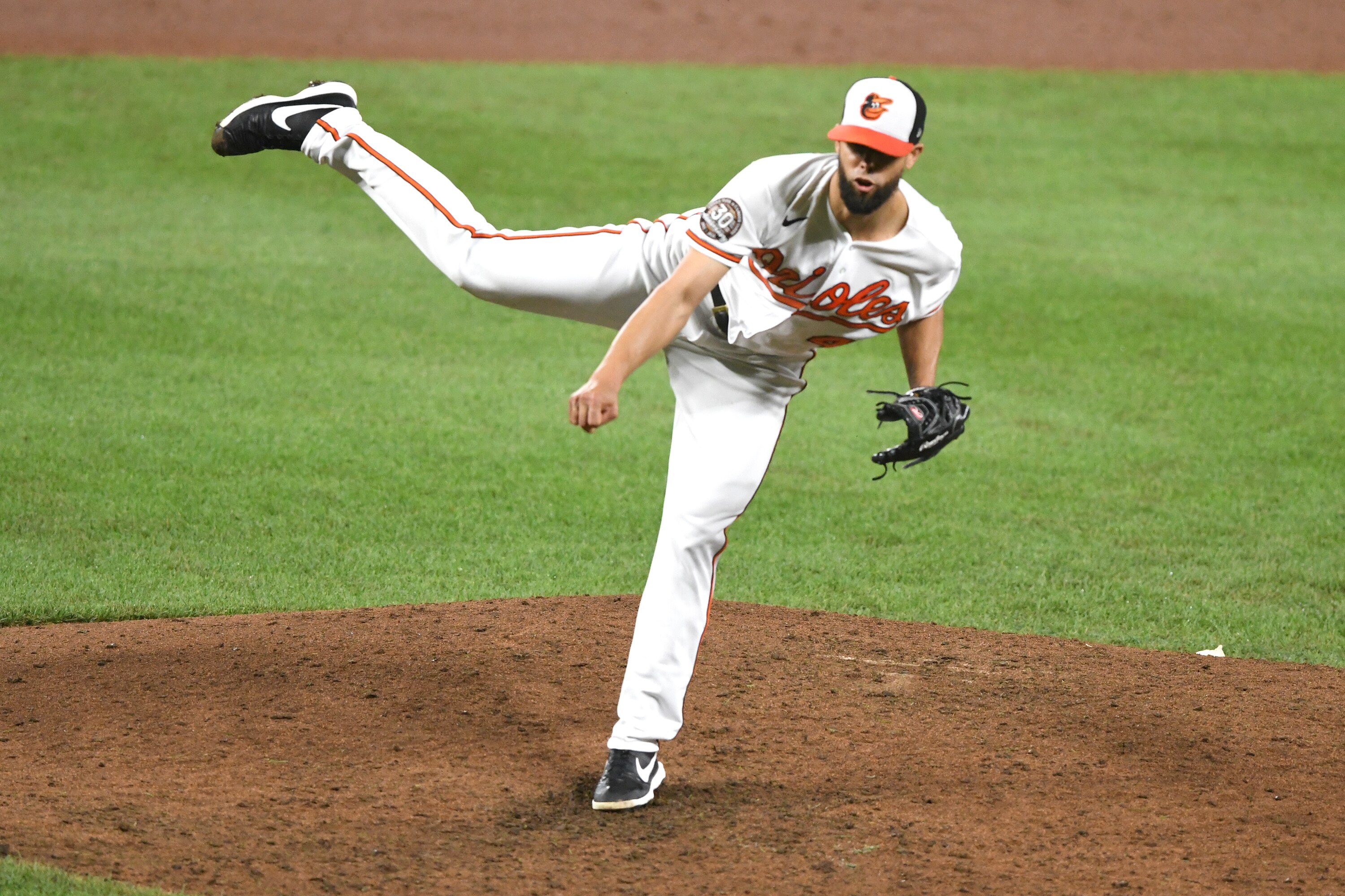 BALTIMORE, MD - JULY 26:  Jorge Lopez #48 of the Baltimore Orioles pitches in the ninth inning during a baseball game against the Tampa Bay Rays at Oriole Park at Camden Yards on July 26, 2022 in Baltimore, Maryland.  (Photo by Mitchell Layton/Getty Images)