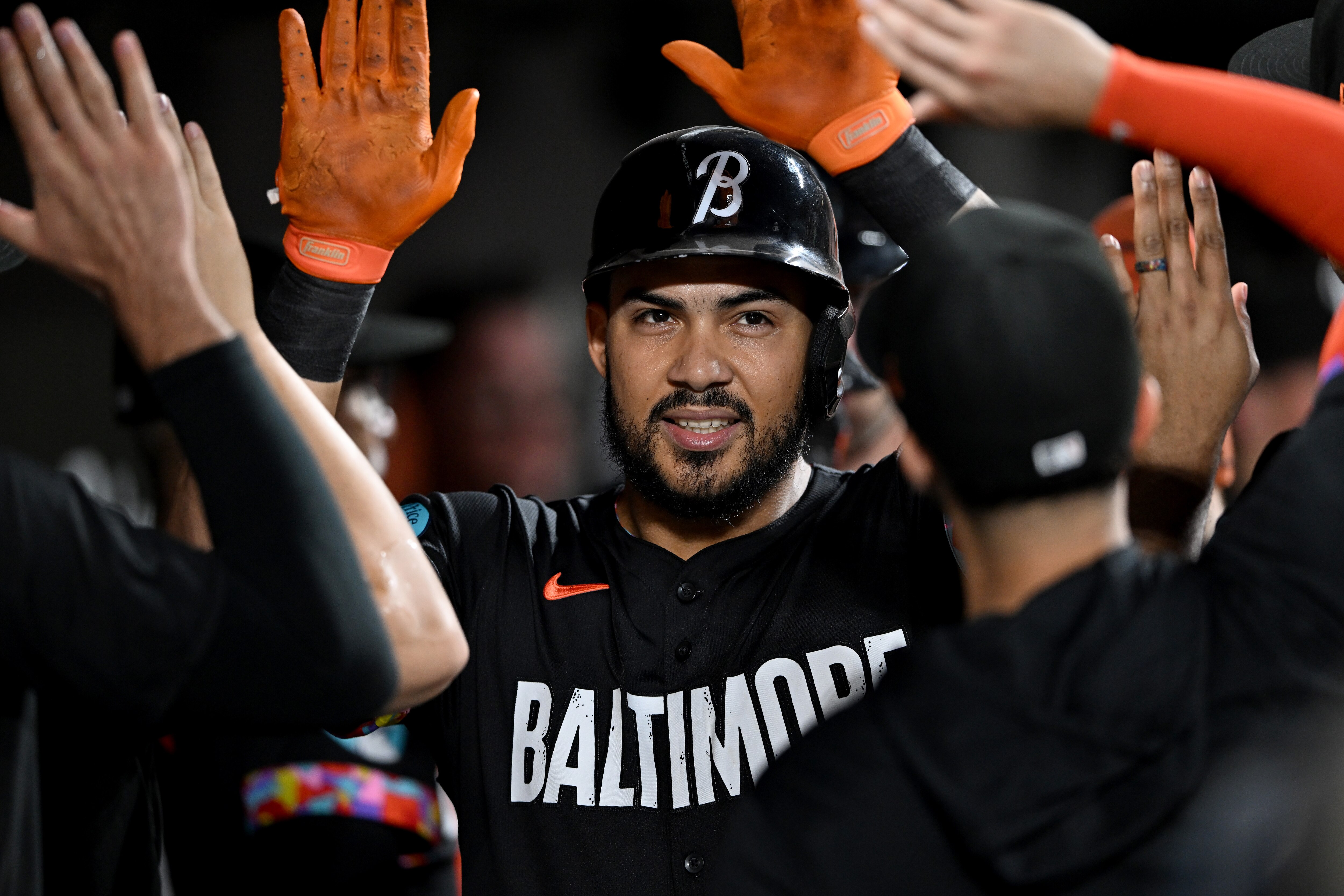 Anthony Santander celebrates with teammates in the dugout after his two-run home run in the first inning Friday night at Oriole Park.