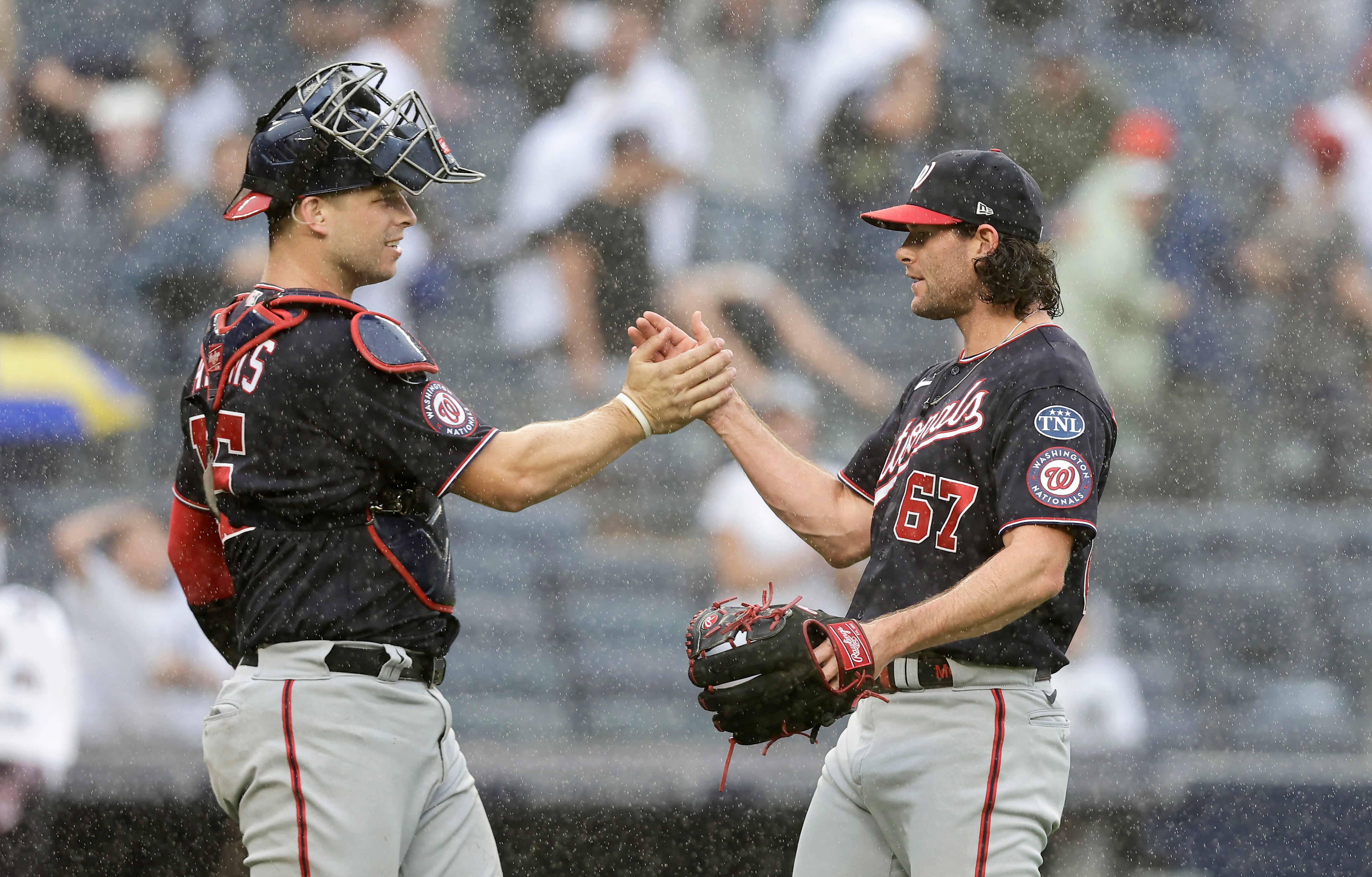 NEW YORK, NEW YORK - AUGUST 24:  Kyle Finnegan #67 and Riley Adams #15 of the Washington Nationals celebrate after defeating the New York Yankees at Yankee Stadium on August 24, 2023 in the Bronx borough of New York City. (Photo by Jim McIsaac/Getty Images)