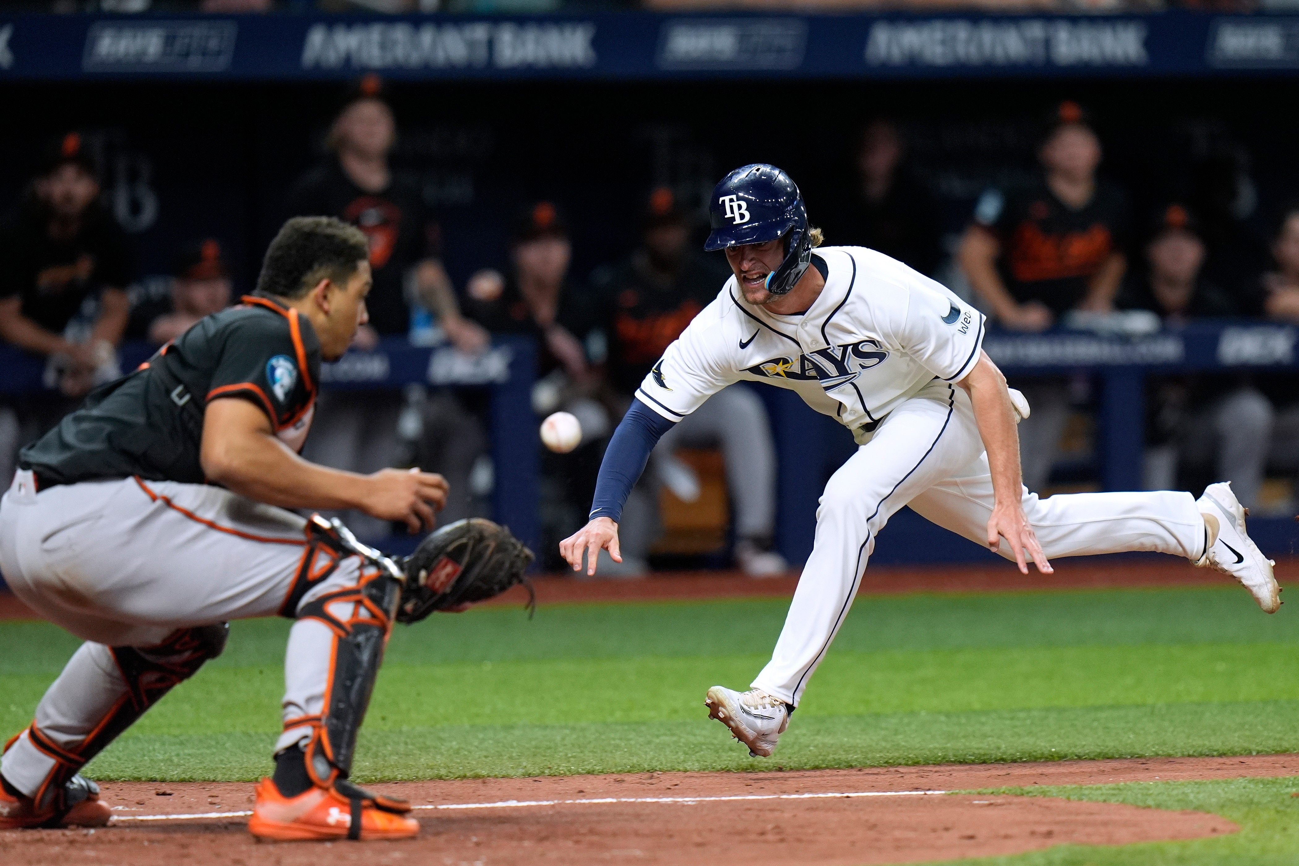 Tampa Bay Rays' Carson Williams, right, scores ahead of the throw to Baltimore Orioles catcher Samuel Basallo during the eighth inning.