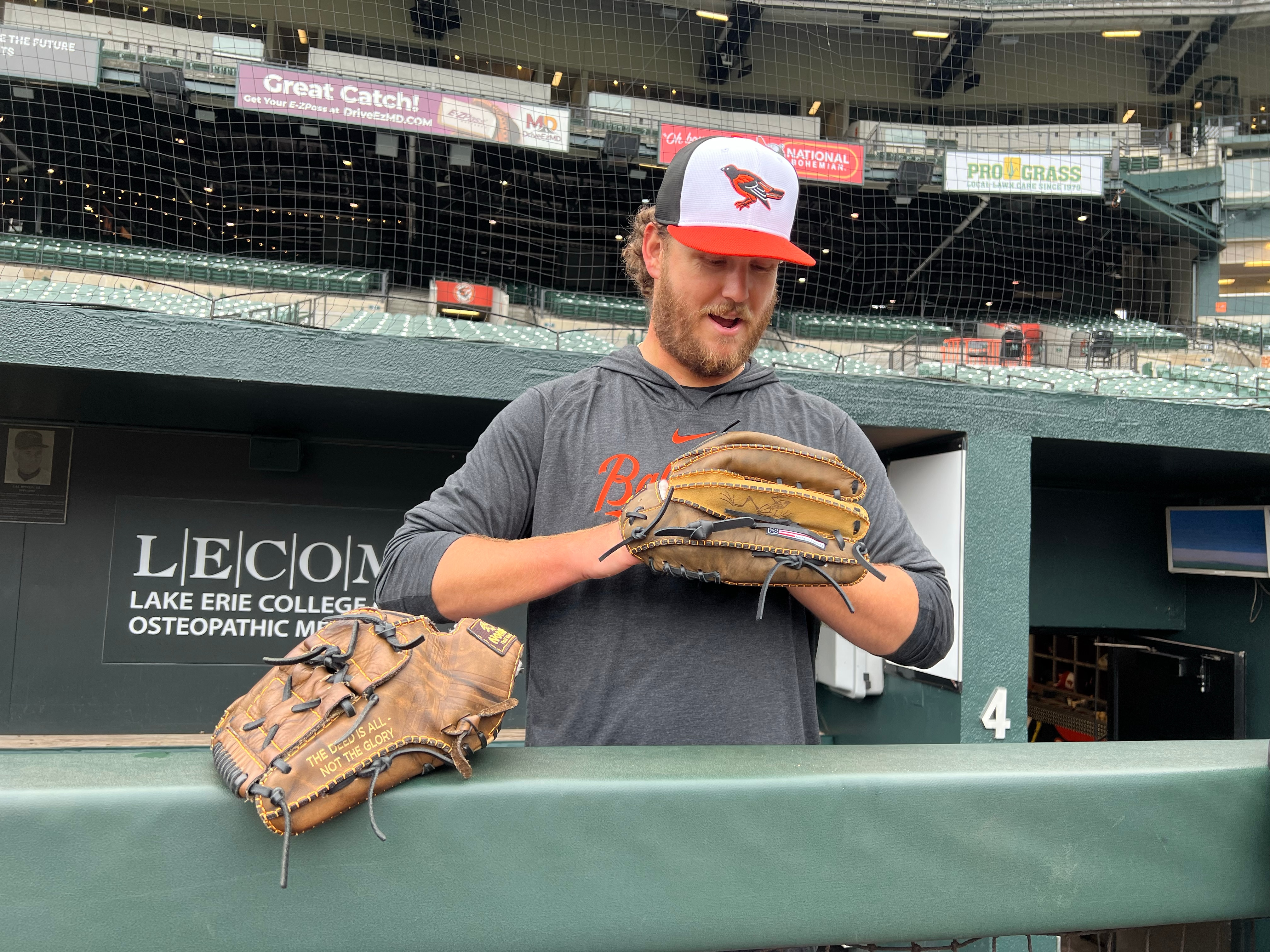 Cole Irvin shows off his glove, which is dedicated to his friend Kevin Holland.