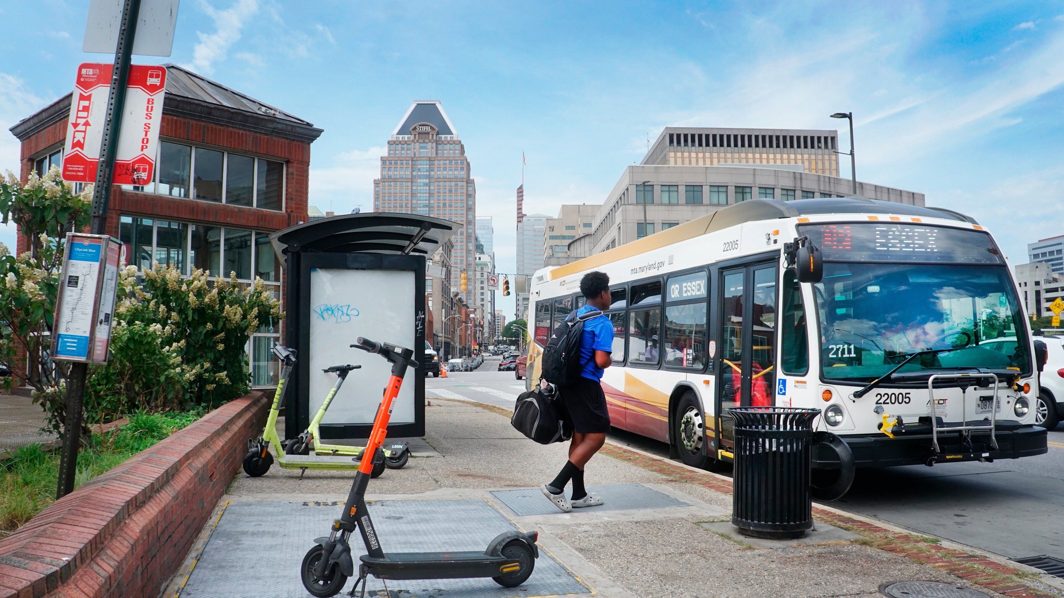 CityLink Orange pulls into a stop on East Baltimore Street just past President Street on Aug 25, 2023.